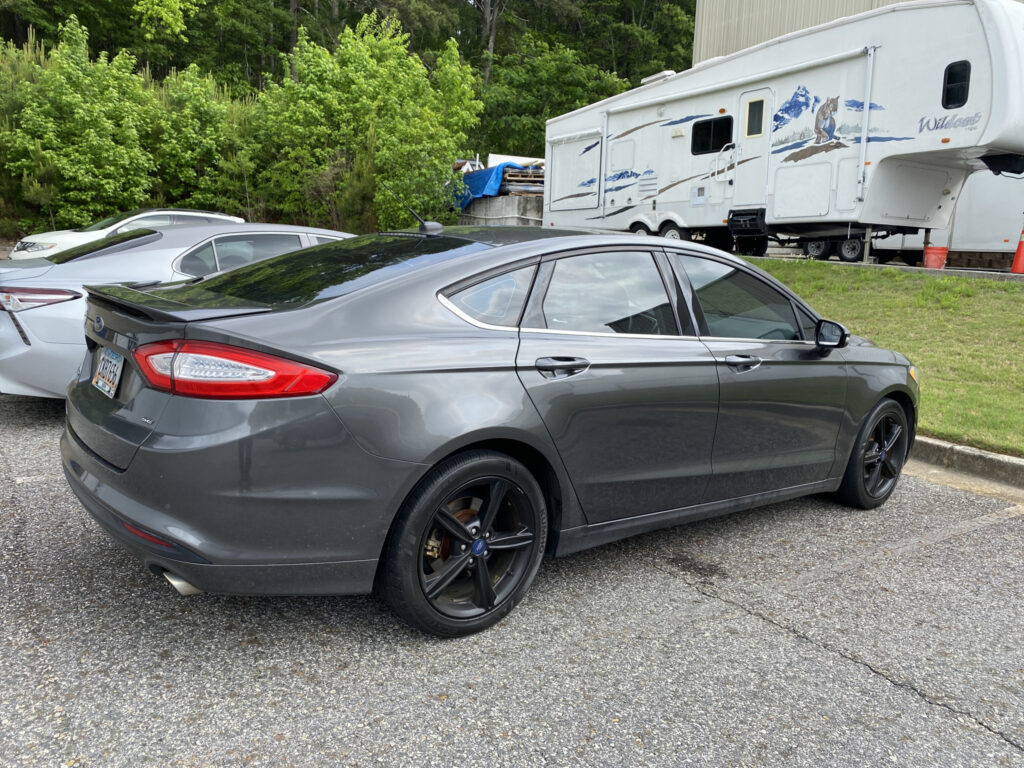 Ford Fusion with ceramic window tint - mobile installation with RV in background