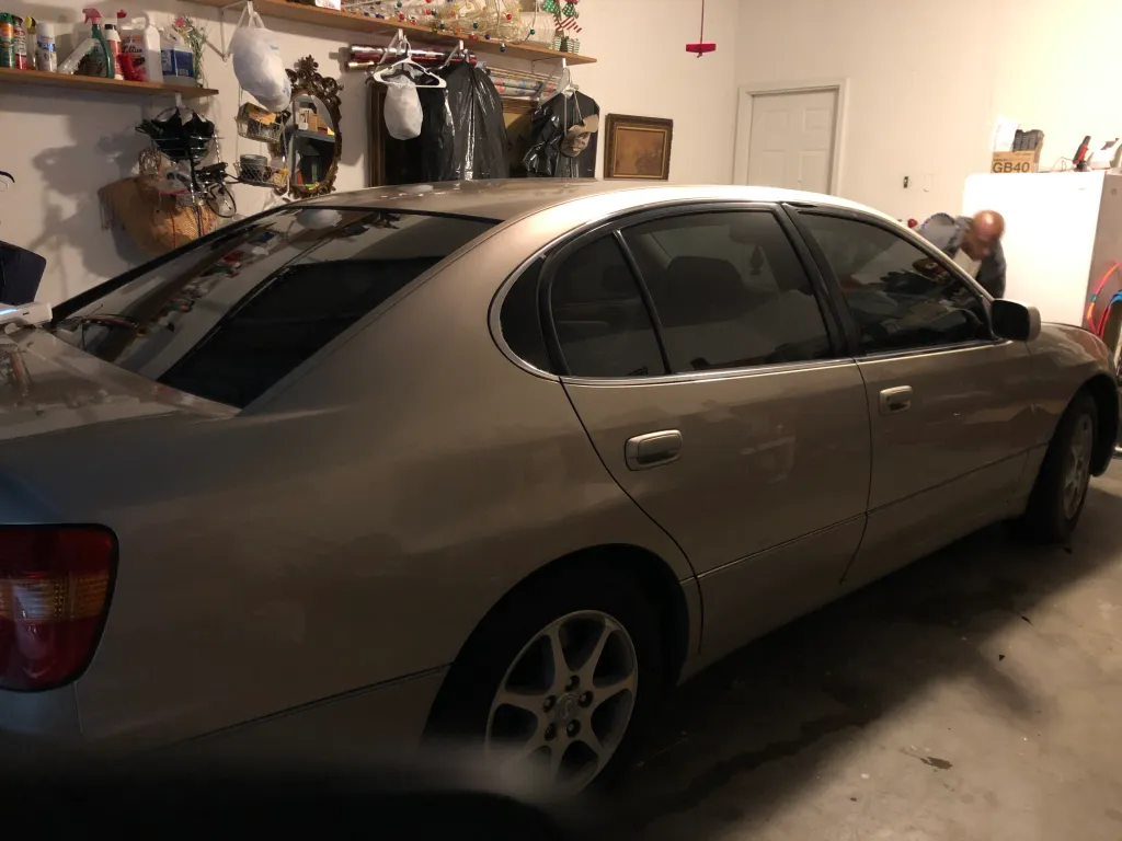 Tinted sedan in a home garage