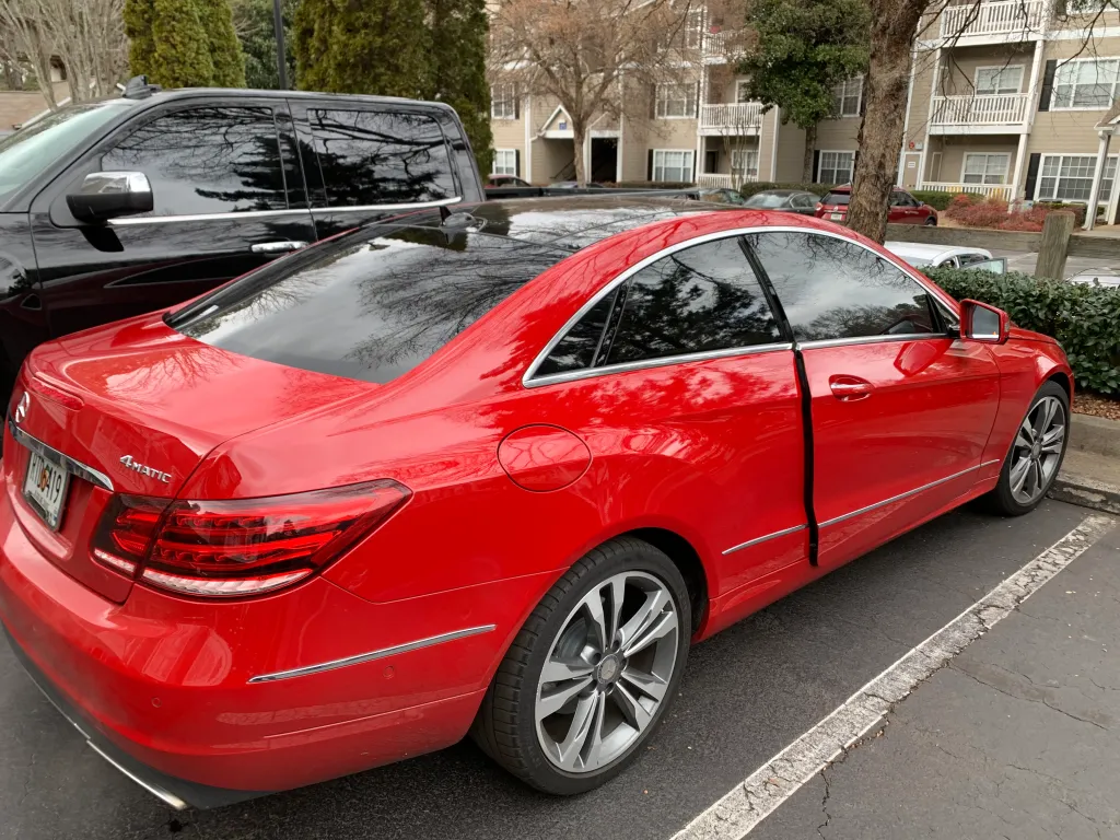 Bright red Mercedes coupe with fresh window tint