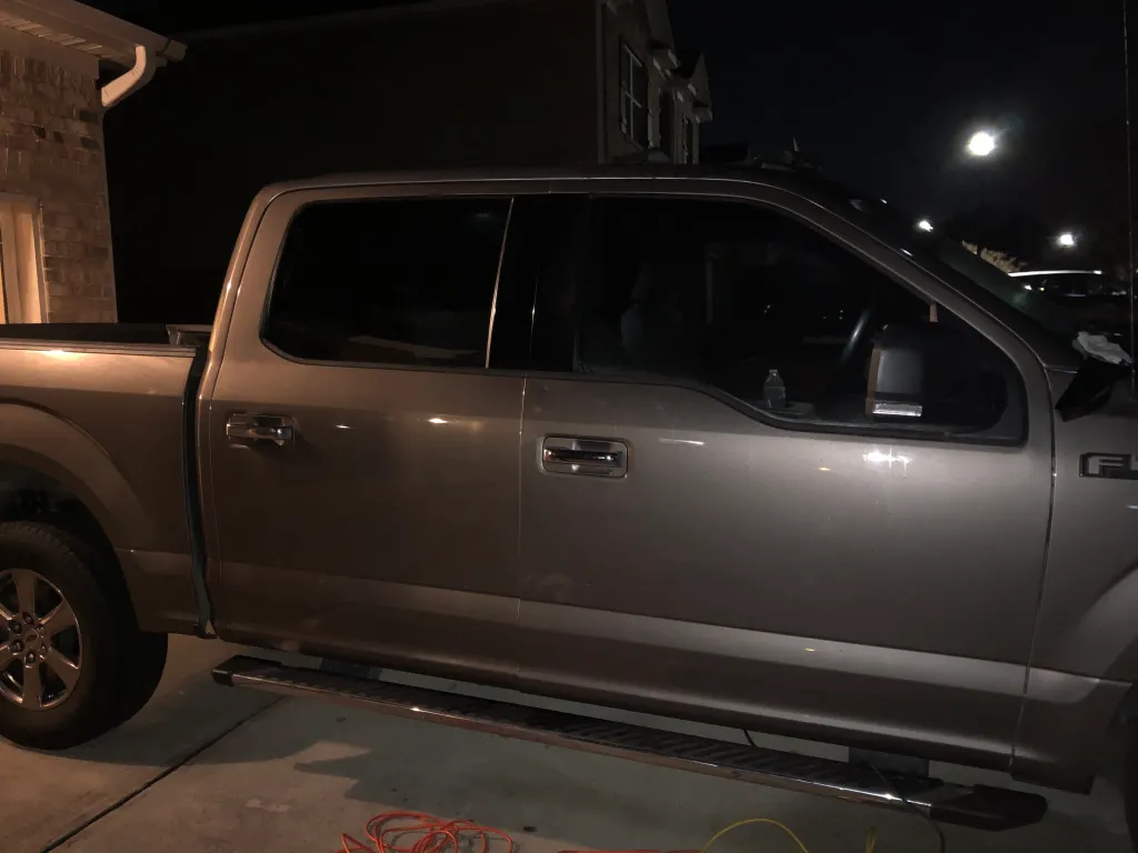 Ford F-150 truck with dark tint for privacy at night