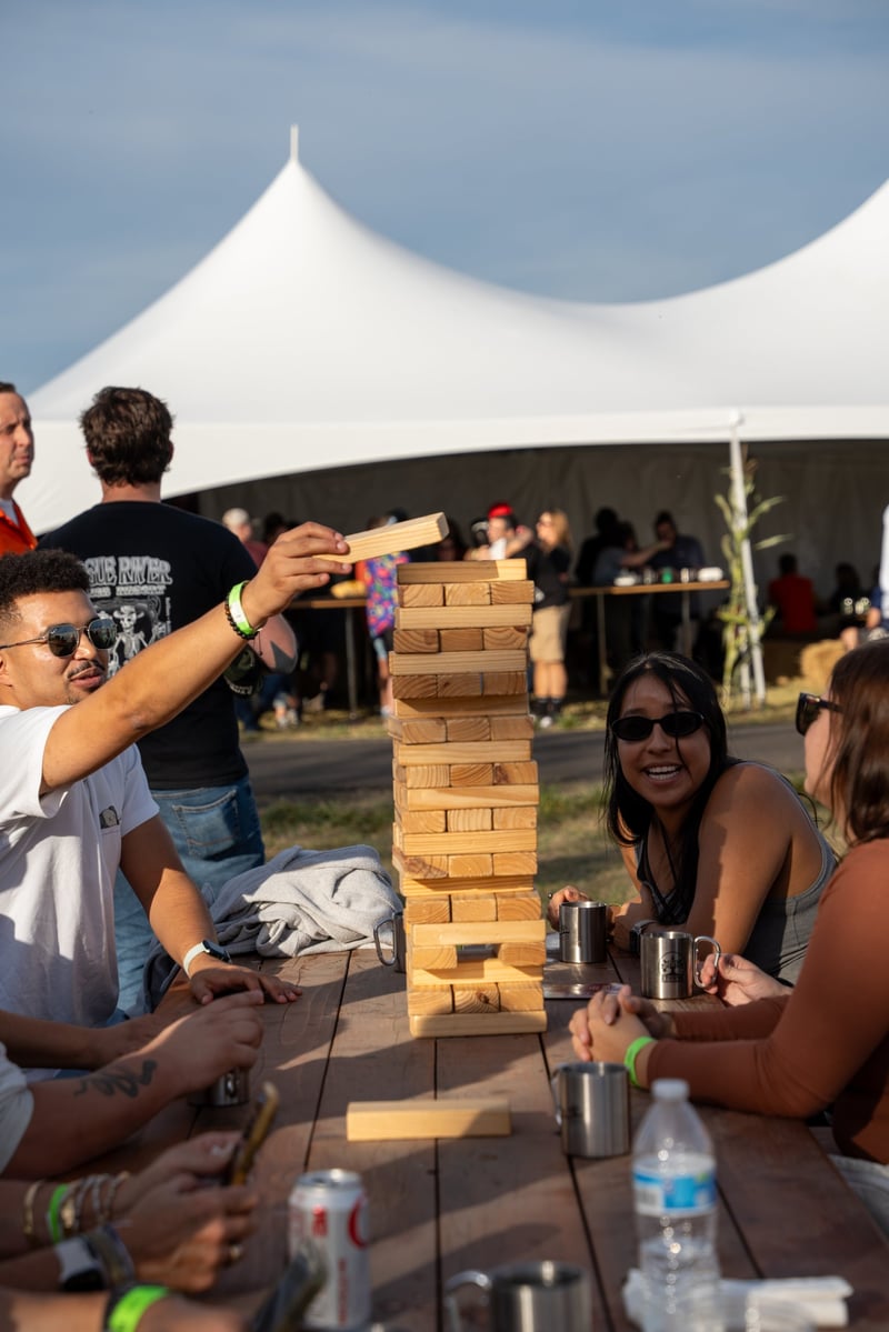 Participants enjoying a game of Jenga at Harvest Party 2024.