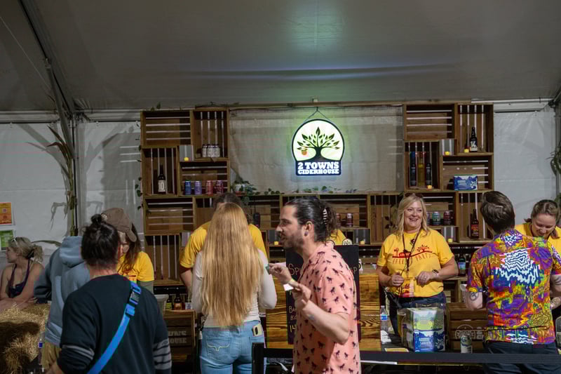 A lively cider tasting booth at Harvest Party 2024.