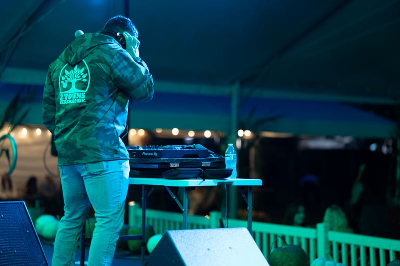 A DJ performing at the 2 Towns Ciderhouse Harvest Party 2025.