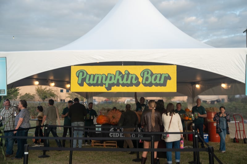 Guests enjoying the Pumpkin Bar at the 2 Towns Ciderhouse Harvest Party 2025.