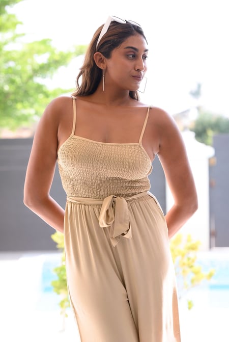 Cream Belted Solid Jumpsuit with a Shirred Silhouette