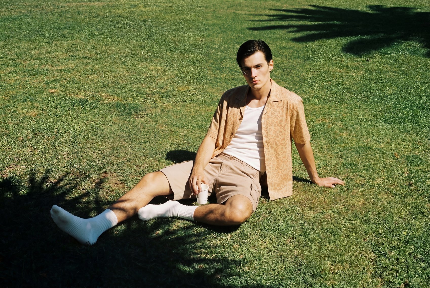 Modern styling of a Men's summer shirt in a casual outdoor setting