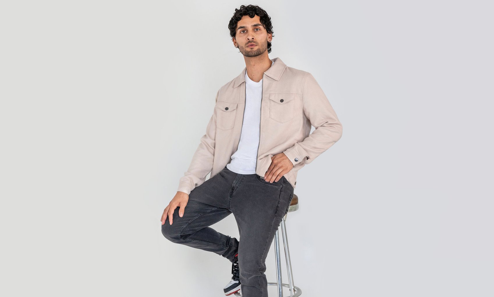 A man in a smart utility jacket from Enorsia's men's collection.
