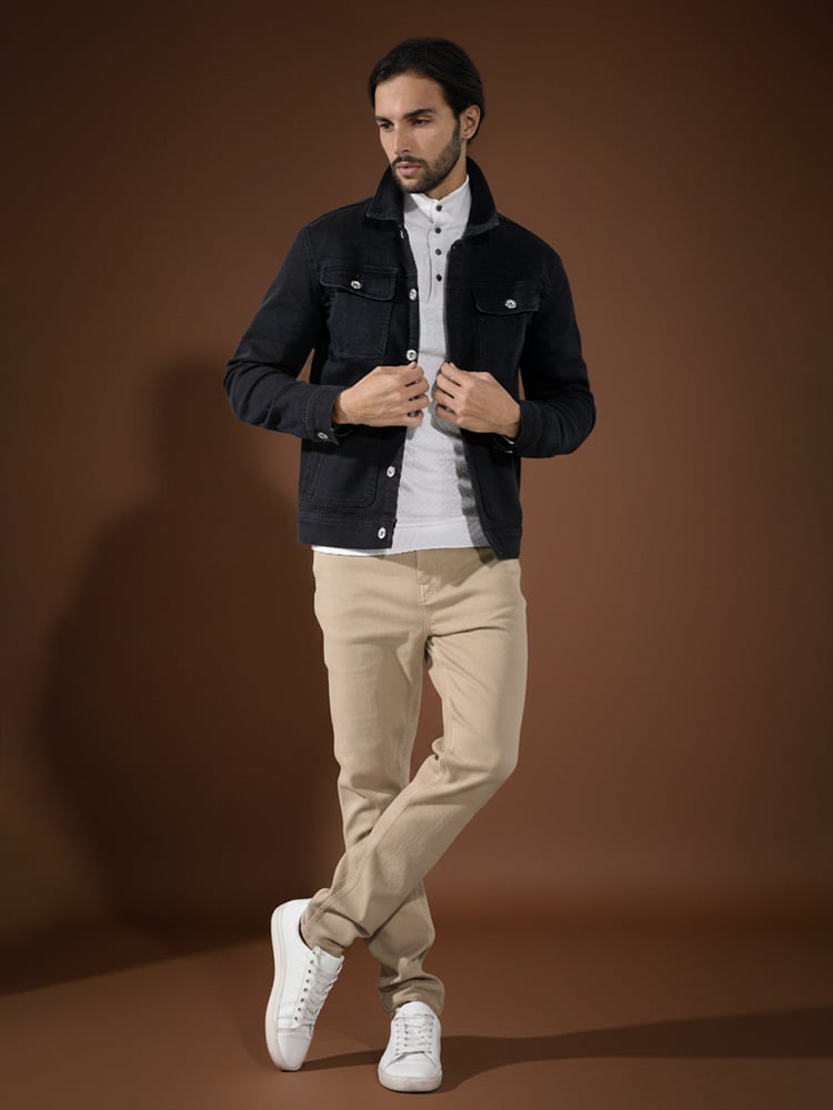 A man wearing structured outerwear from the Enorsia collection.