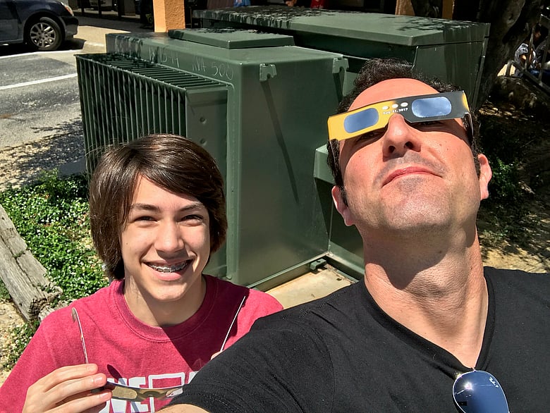 Father and son enjoying the eclipse