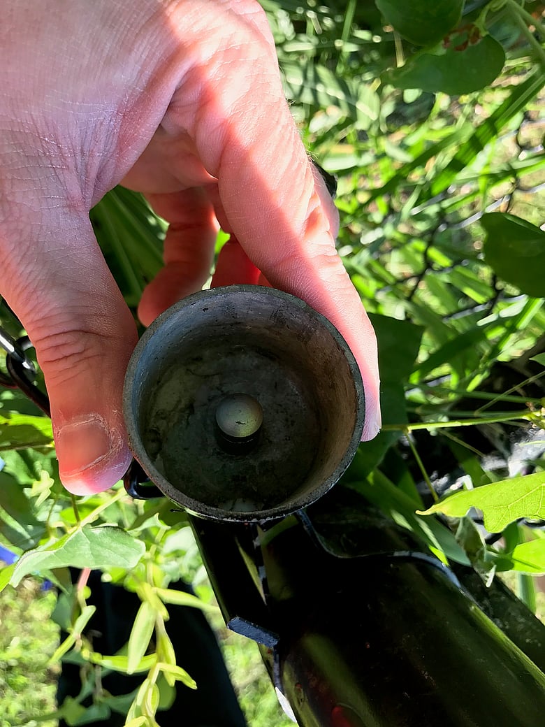 Nano under a fence post cap