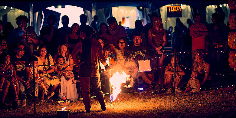 entertainer performing a fire act at Pumpkin Nights