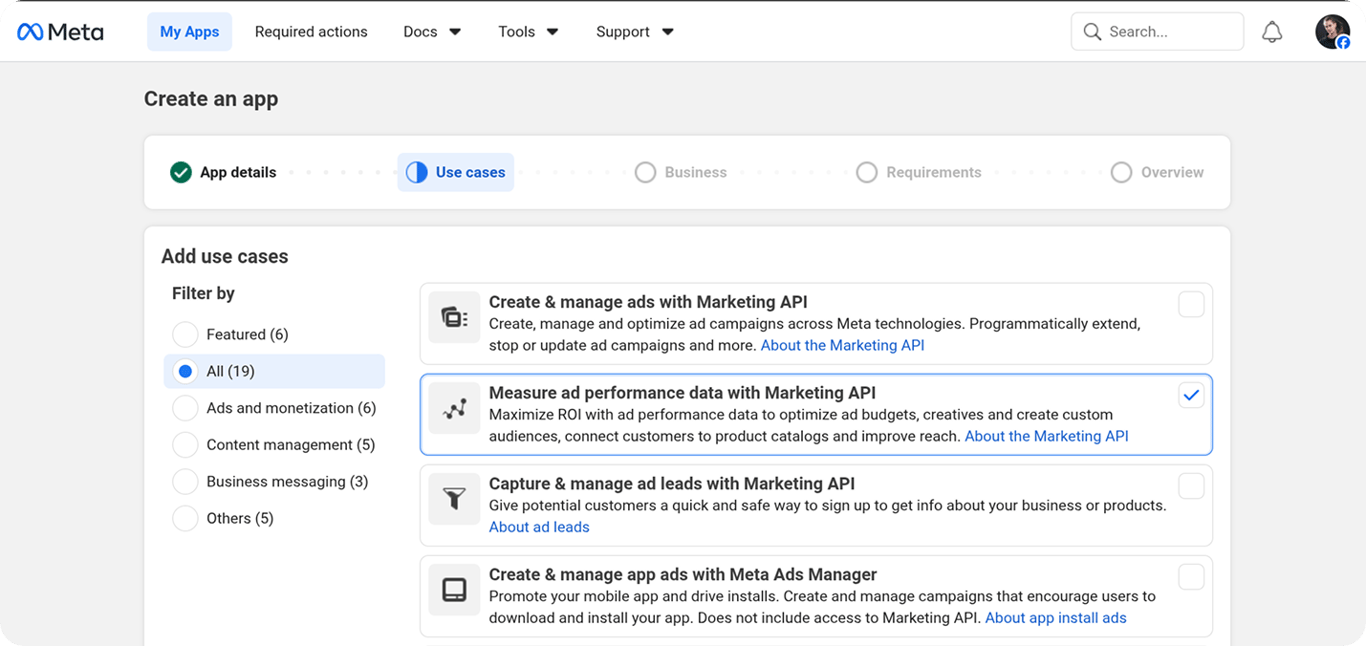 App creation use-case step with "Measure ad performance data with Marketing API" selected and a Business Portfolio connected
