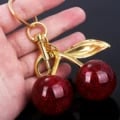 Fashion Delicious Red Cherry Keychain - Stylish and Durable Alloy Pendant for Keys, Bags, and Backpacks - Vibrant Red Color with Intricate Detailing - Perfect Gift Idea for Men and Women - Lightweight and Compact Accessory for Everyday Use