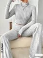 Sophisticated Stand Collar Navel T-Shirt with Trendy Trumpet Pants Set - Flared High-Waisted Pants for a Chic and Elegant Look, Exposing a Hint of Skin and Accentuating Your Waist - Fashionable and Edgy Outfit for a Stylish Wardrobe