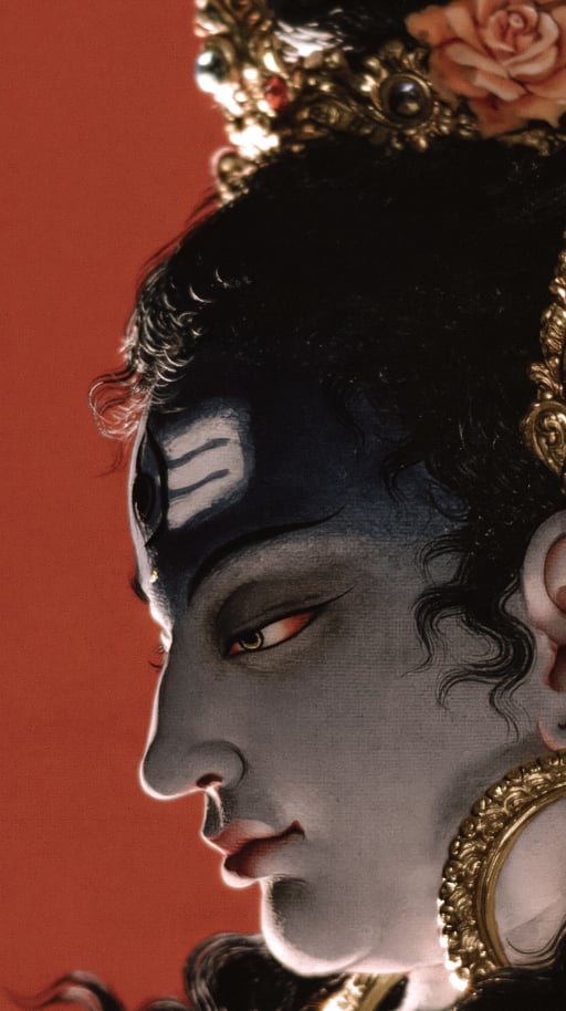 Dramatic close-up portrait with a warm red background and gold ornament
