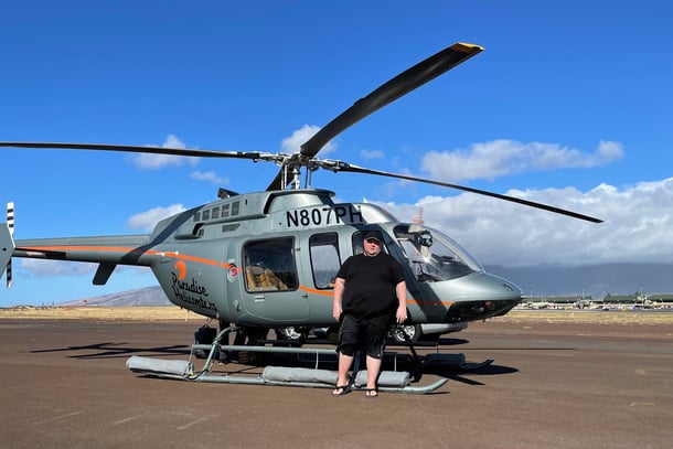 Mark standing in front of a helicopter in Hawaii