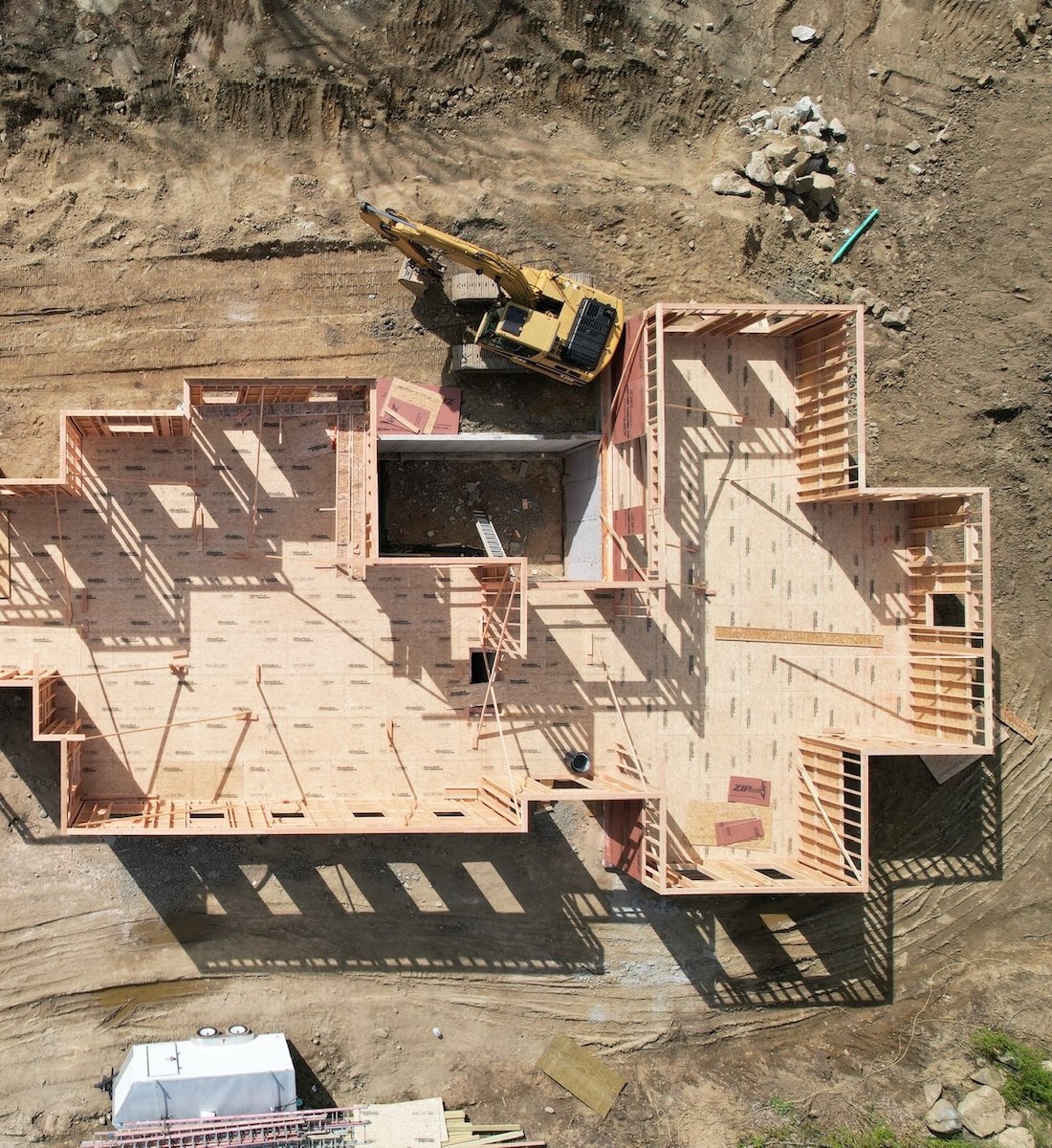 Construction site with cranes and building materials