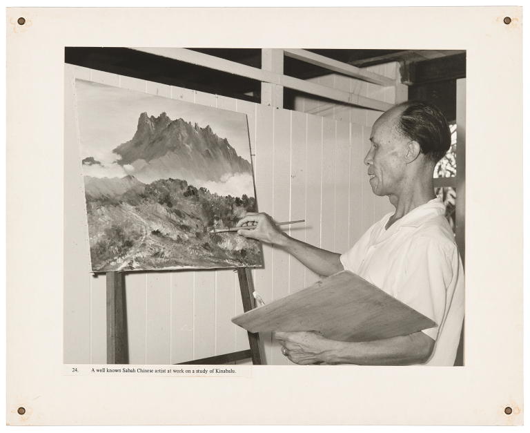 'A well known Sabah Chinese artist at work on a study of Kinabalu' by Hedda Morrison