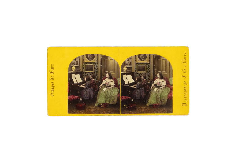 Stereograph of girls playing a piano