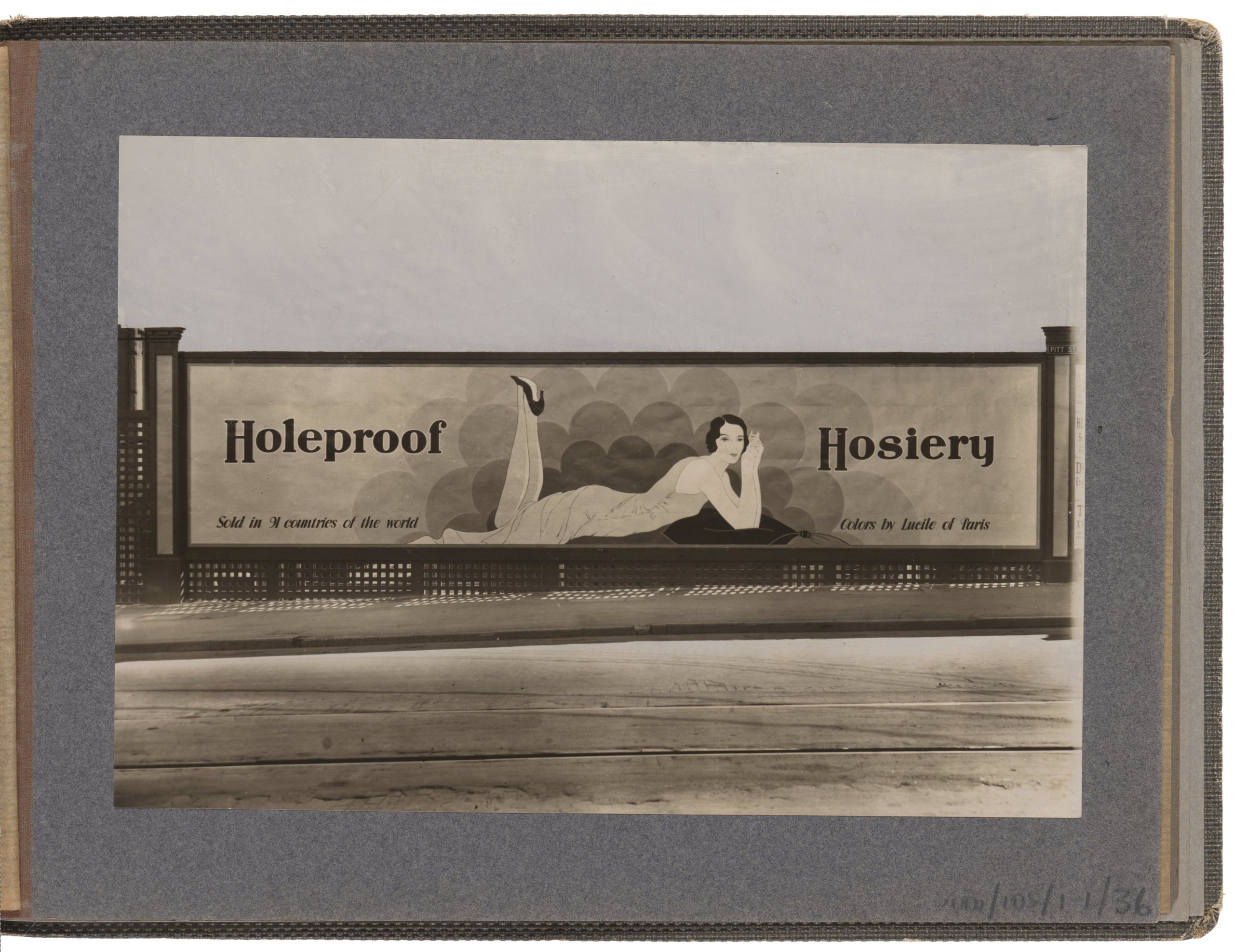 Photograph of roadside wall advertising sign for Holeproof Hosiery