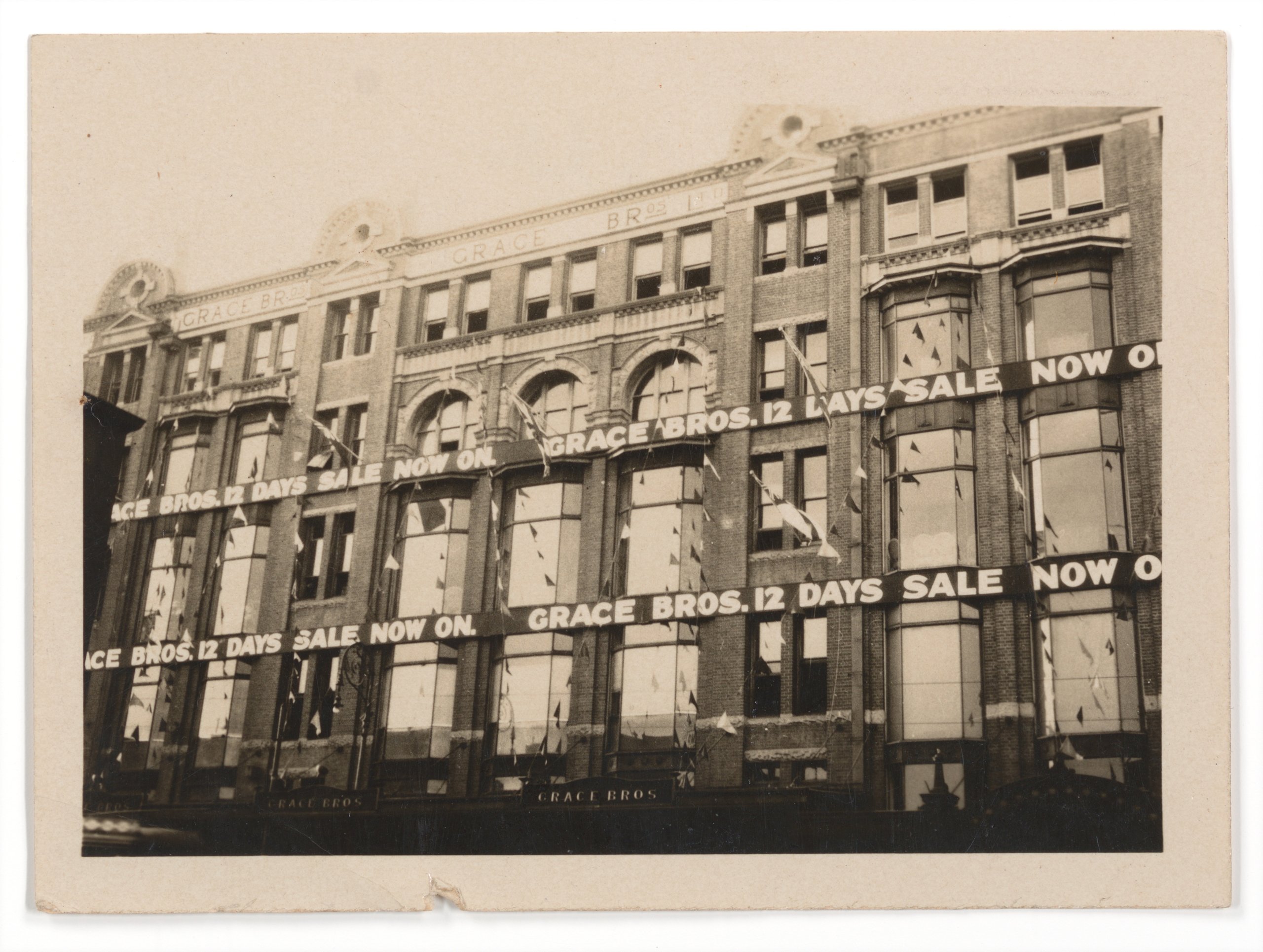 Photograph of advertising signs for Grace Bros 12 Days Sale
