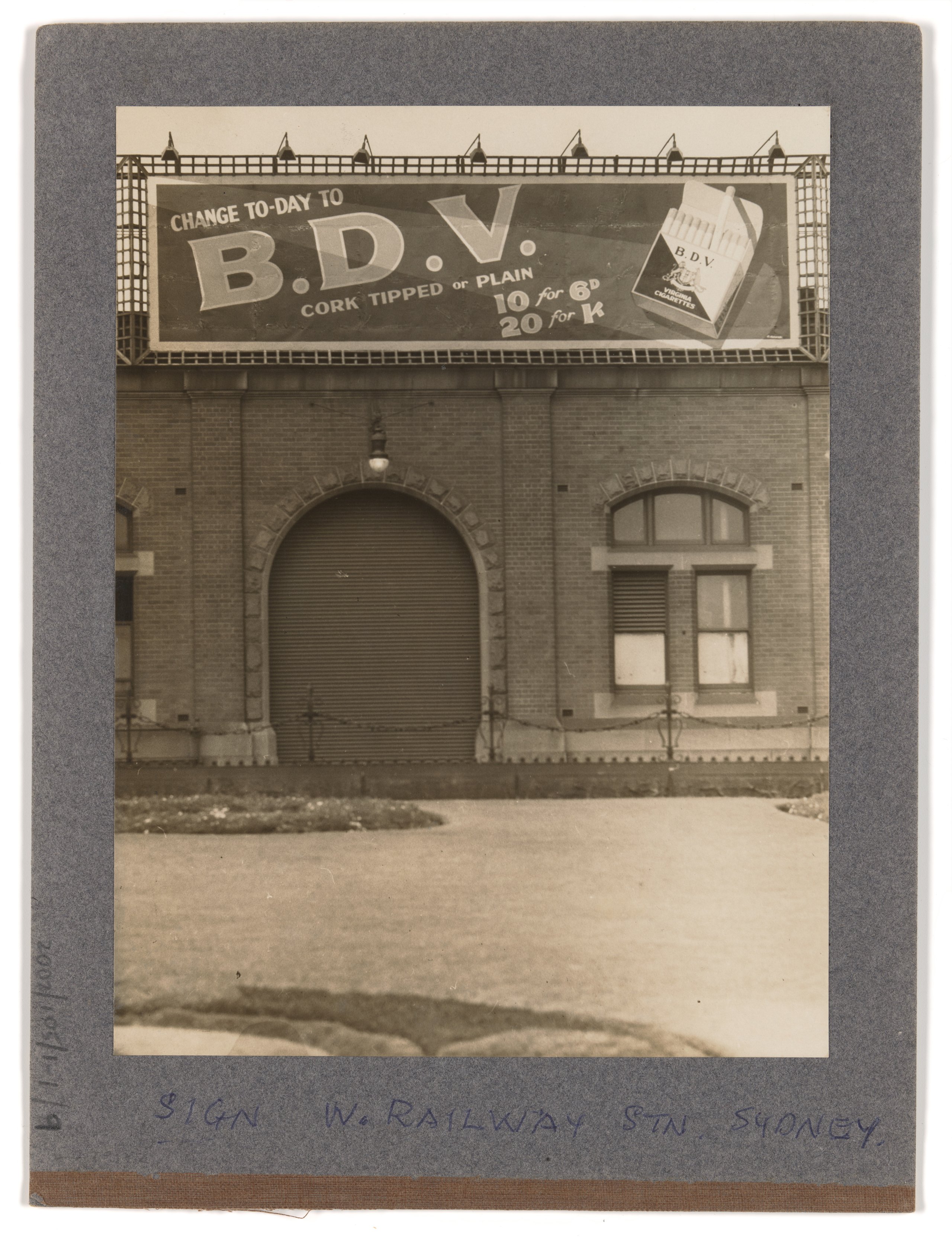 Photograph of advertising billboard for B.D.V. Virginia Cigarettes