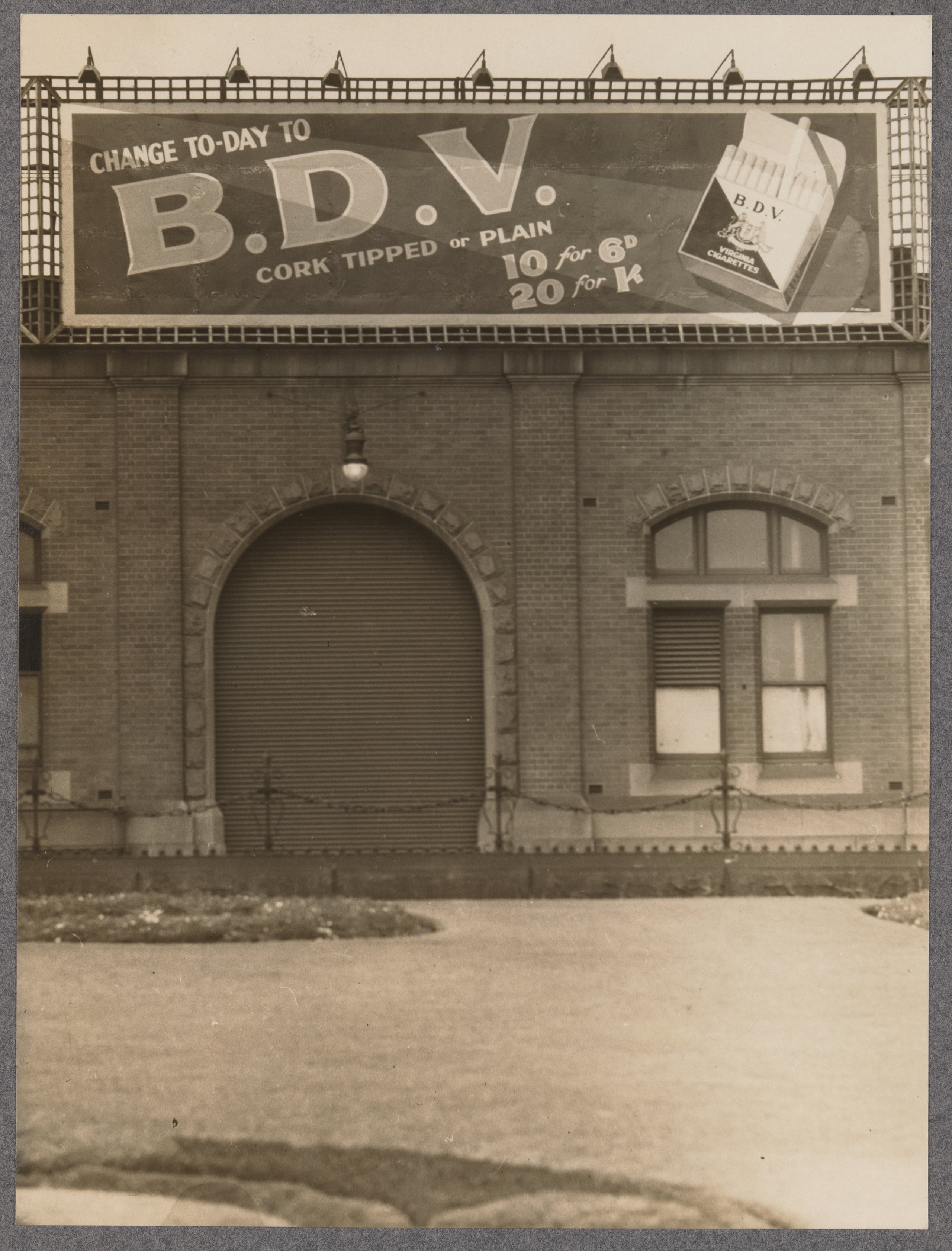 Photograph of advertising billboard for B.D.V. Virginia Cigarettes