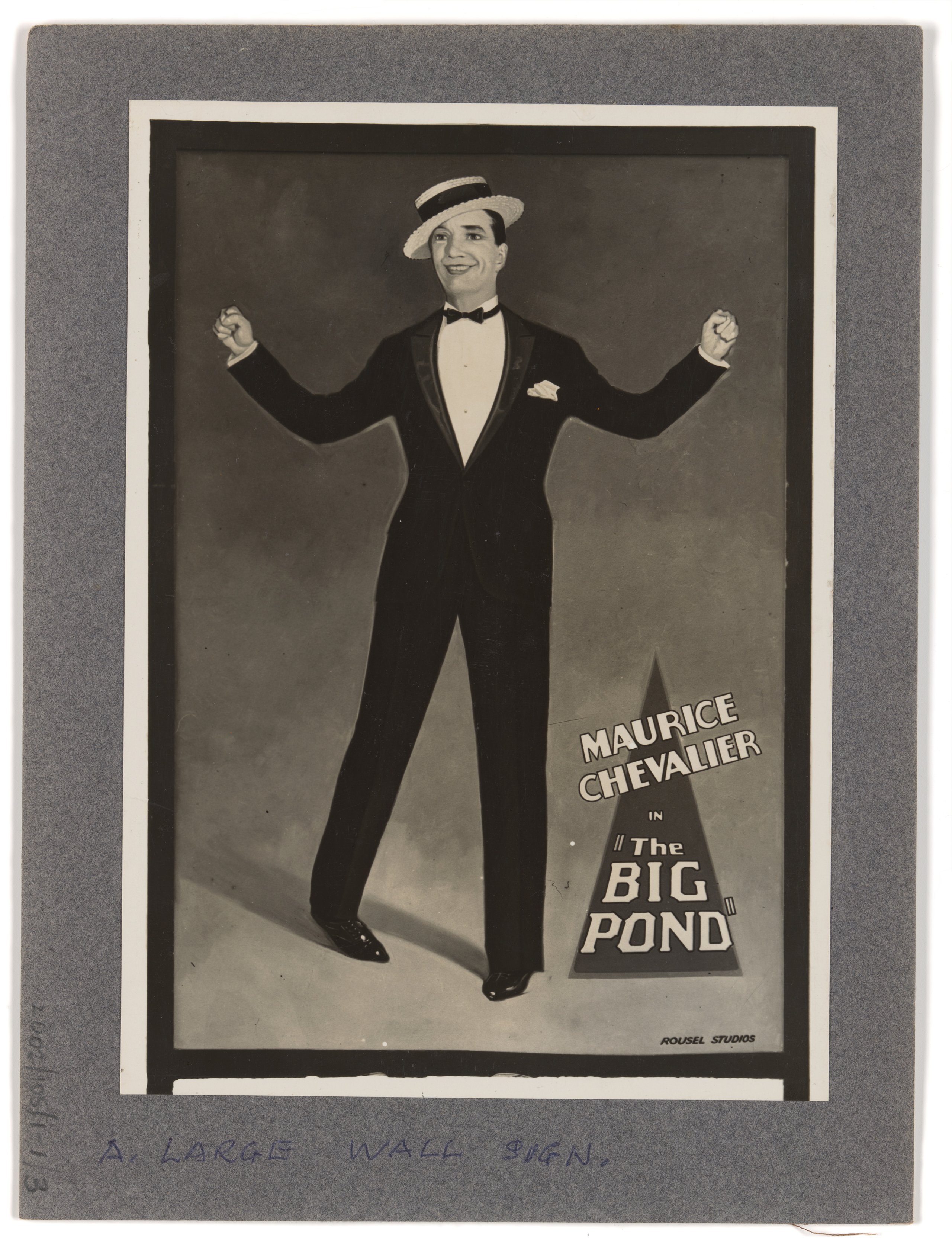Photograph of large wall sign advertising the film "The Big Pond" starring Maurice Chevalier at the Prince Edward Theatre