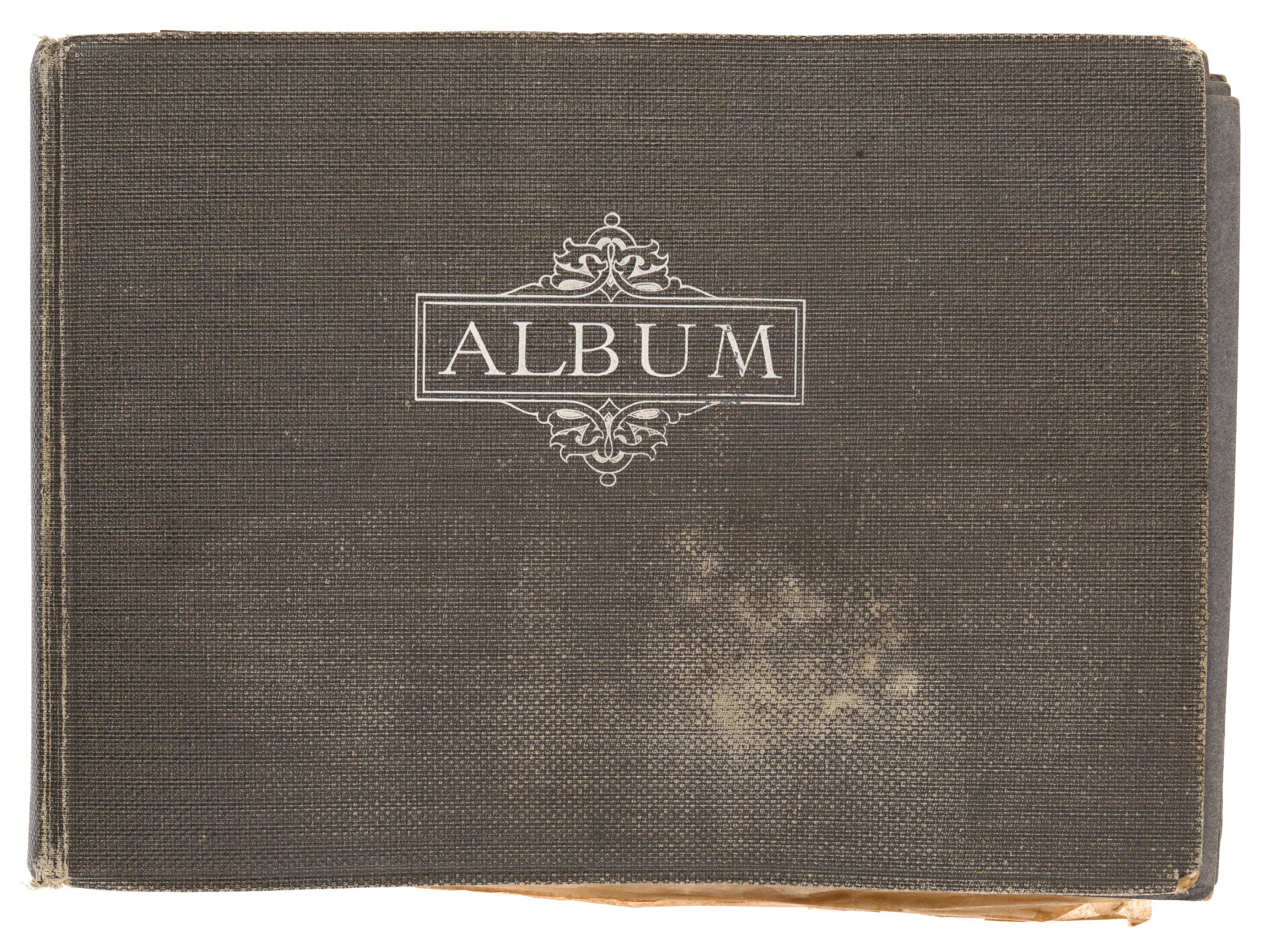 Photograph album containing Rousel Studios advertising signwriting and graphic designs