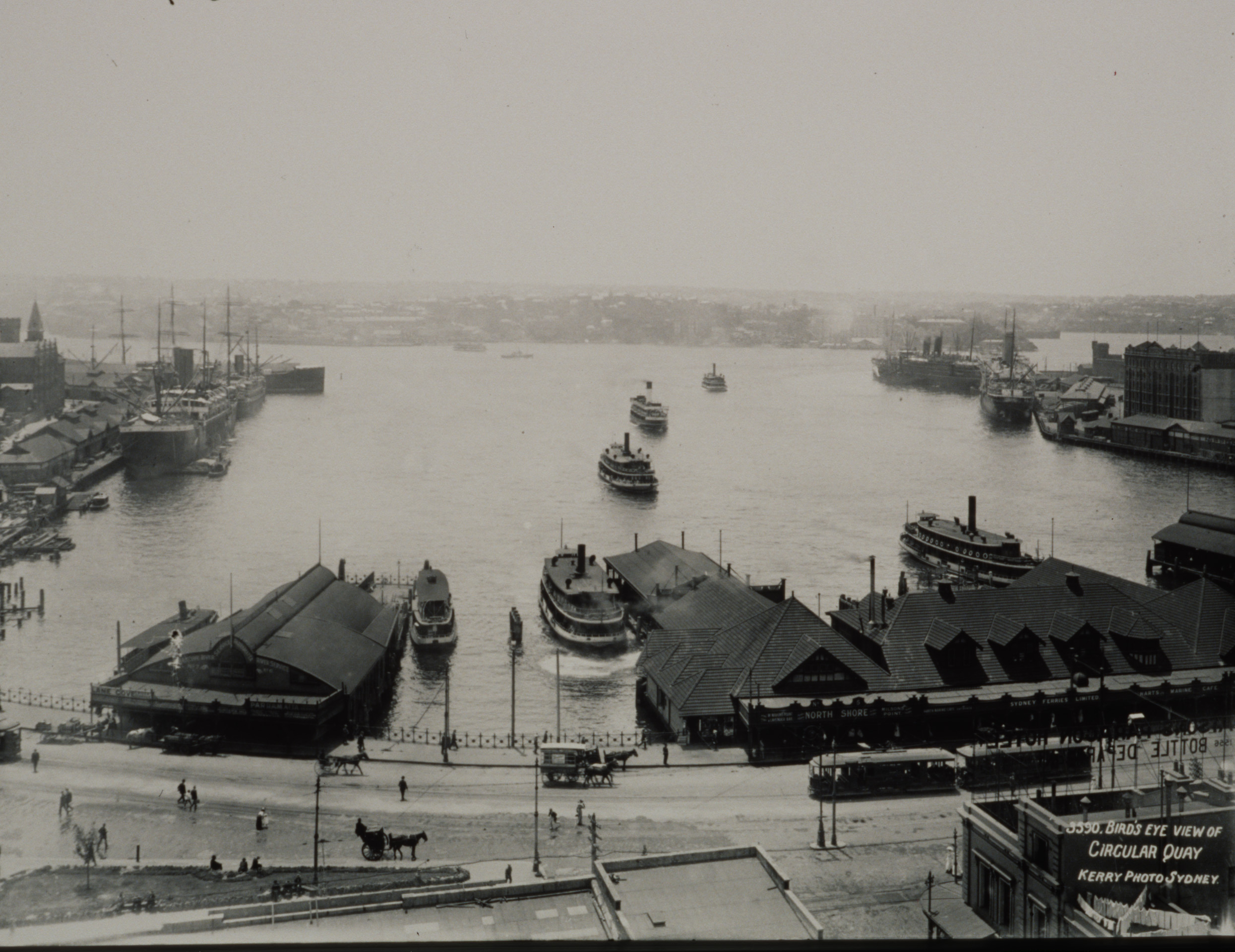 Glass negative of Sydney's Circular Quay showing ferries, ferry wharves, ocean liners, trams and hansom cabs, 1906-1910