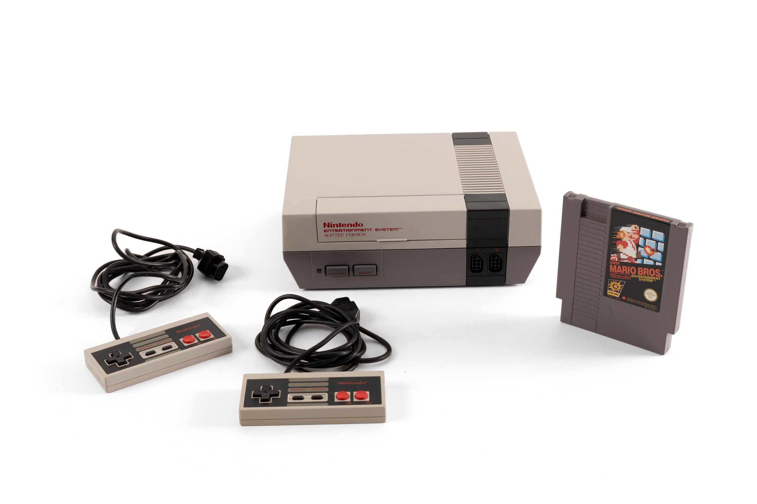 'NES' video game console with accessories and packaging by Nintendo Co Ltd
