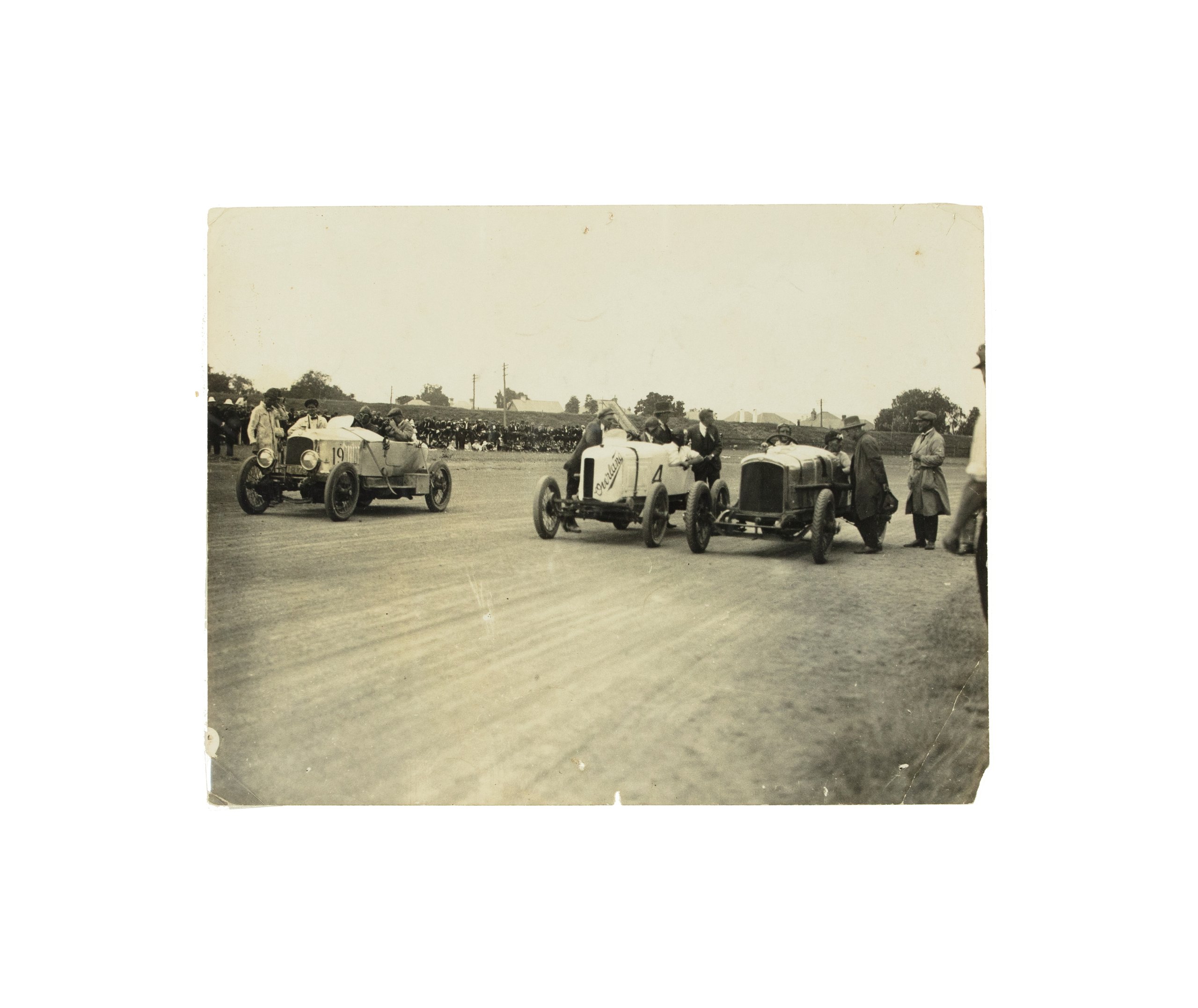 Photograph of Don Harkness at the wheel of his Overland Sports car 'Whitey' at 10 Mile Championships