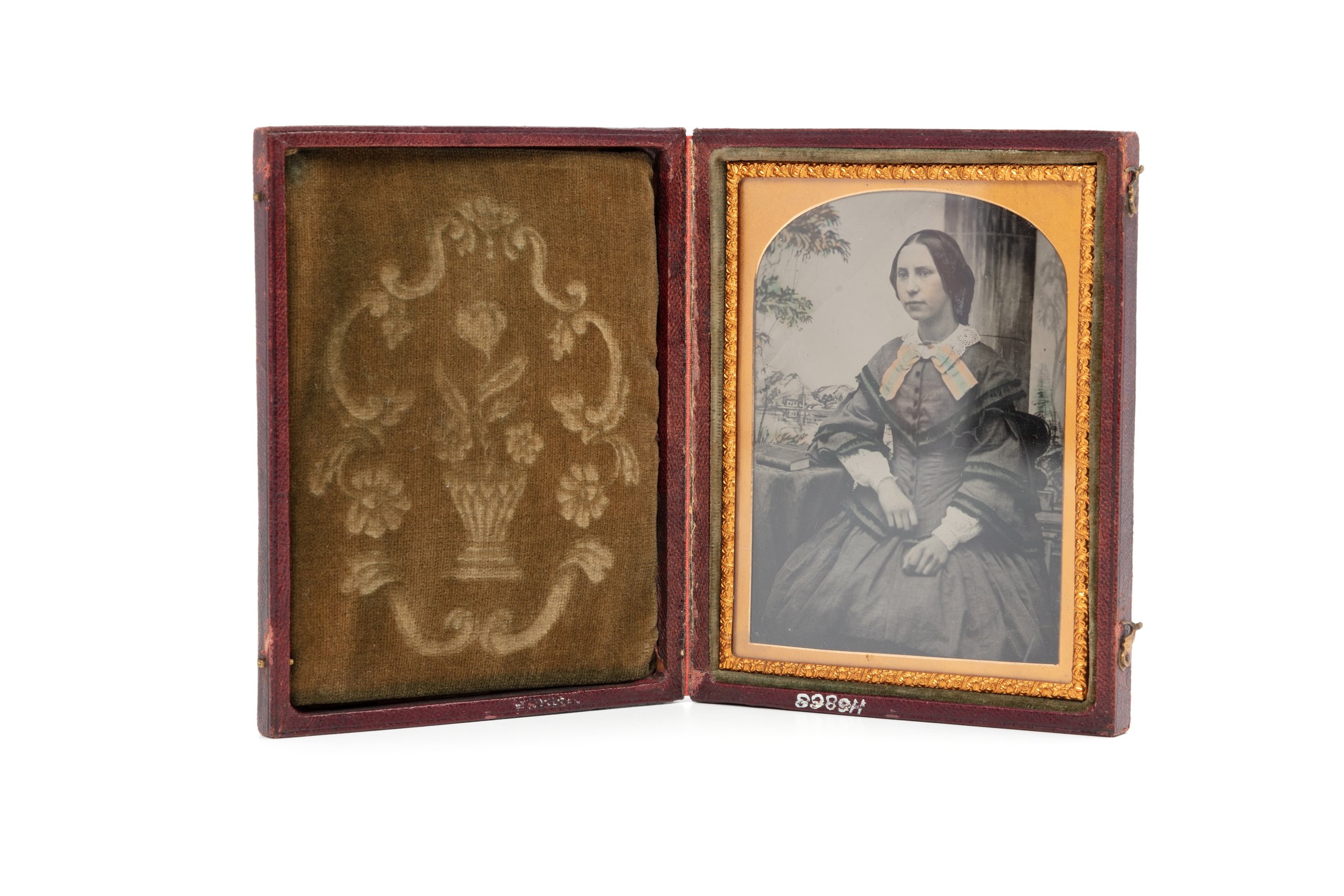 Hand-tinted ambrotype of a seated woman
