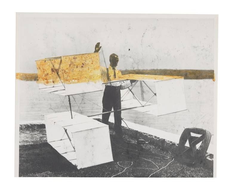 Photograph of Lawrence Hargrave standing beside box kite at Woollahra Point