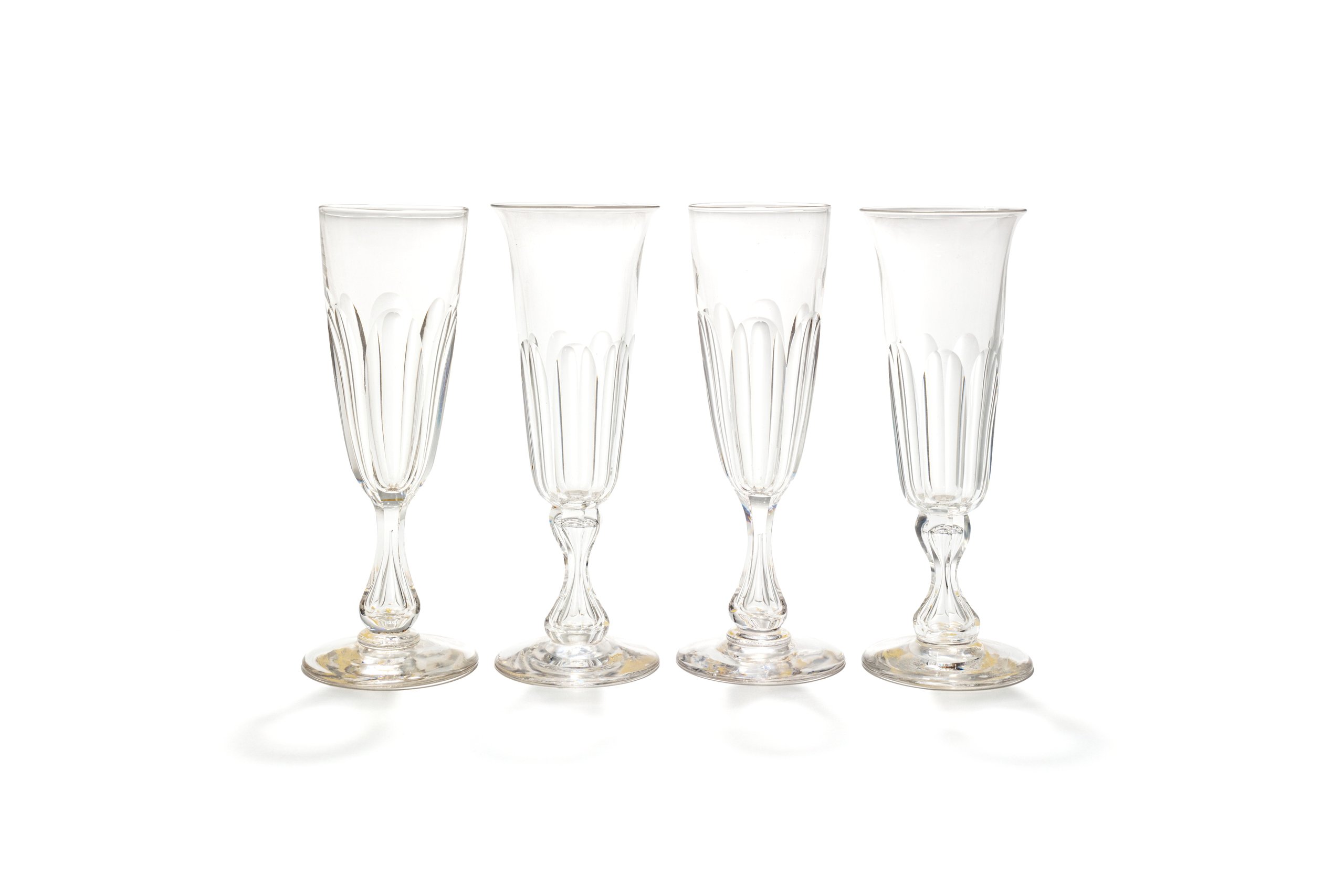 Four English champagne glasses