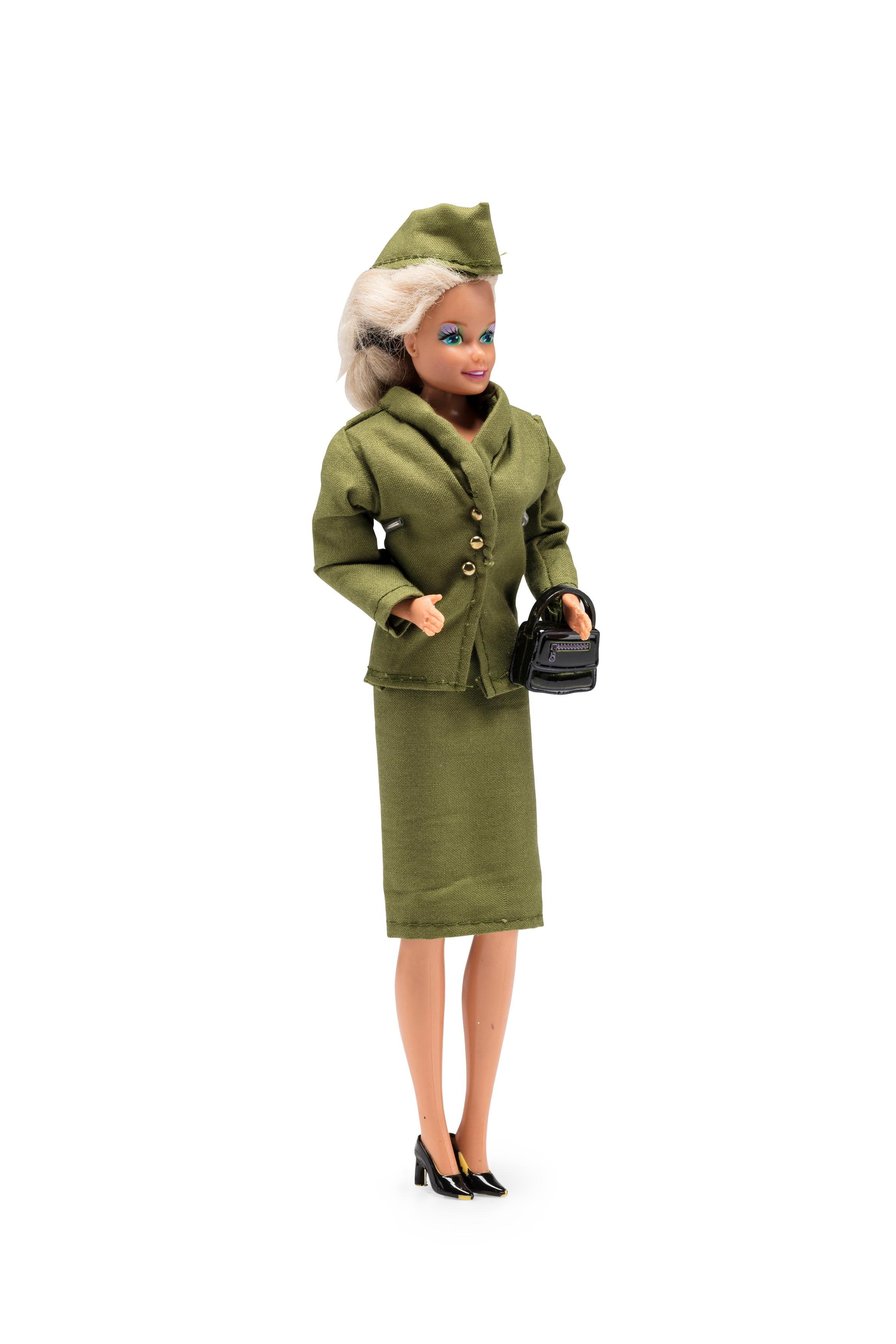 Barbie doll wearing Qantas 'jungle green' uniform worn by flight attendants 1959-1964