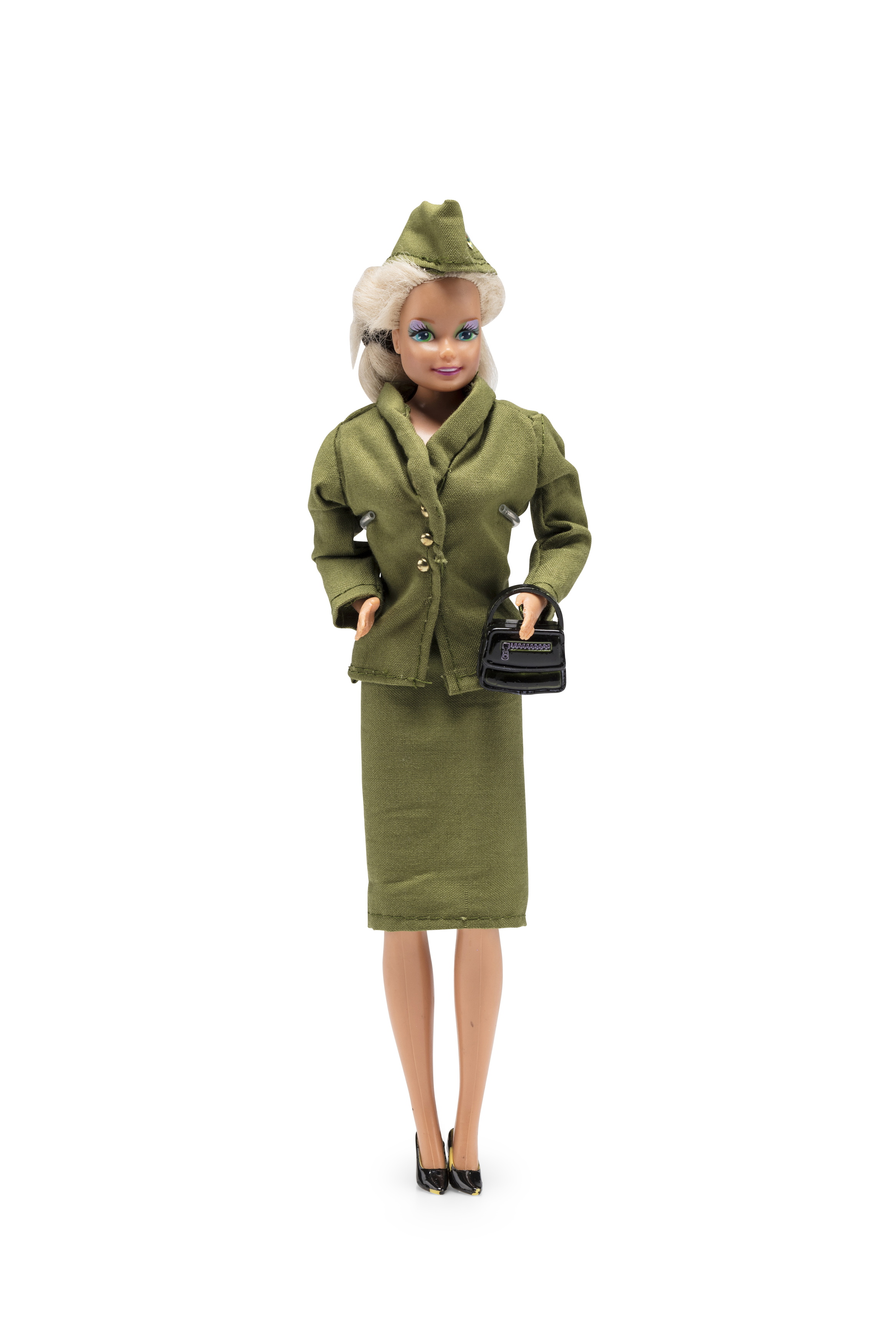 Barbie doll wearing Qantas 'jungle green' uniform worn by flight attendants 1959-1964