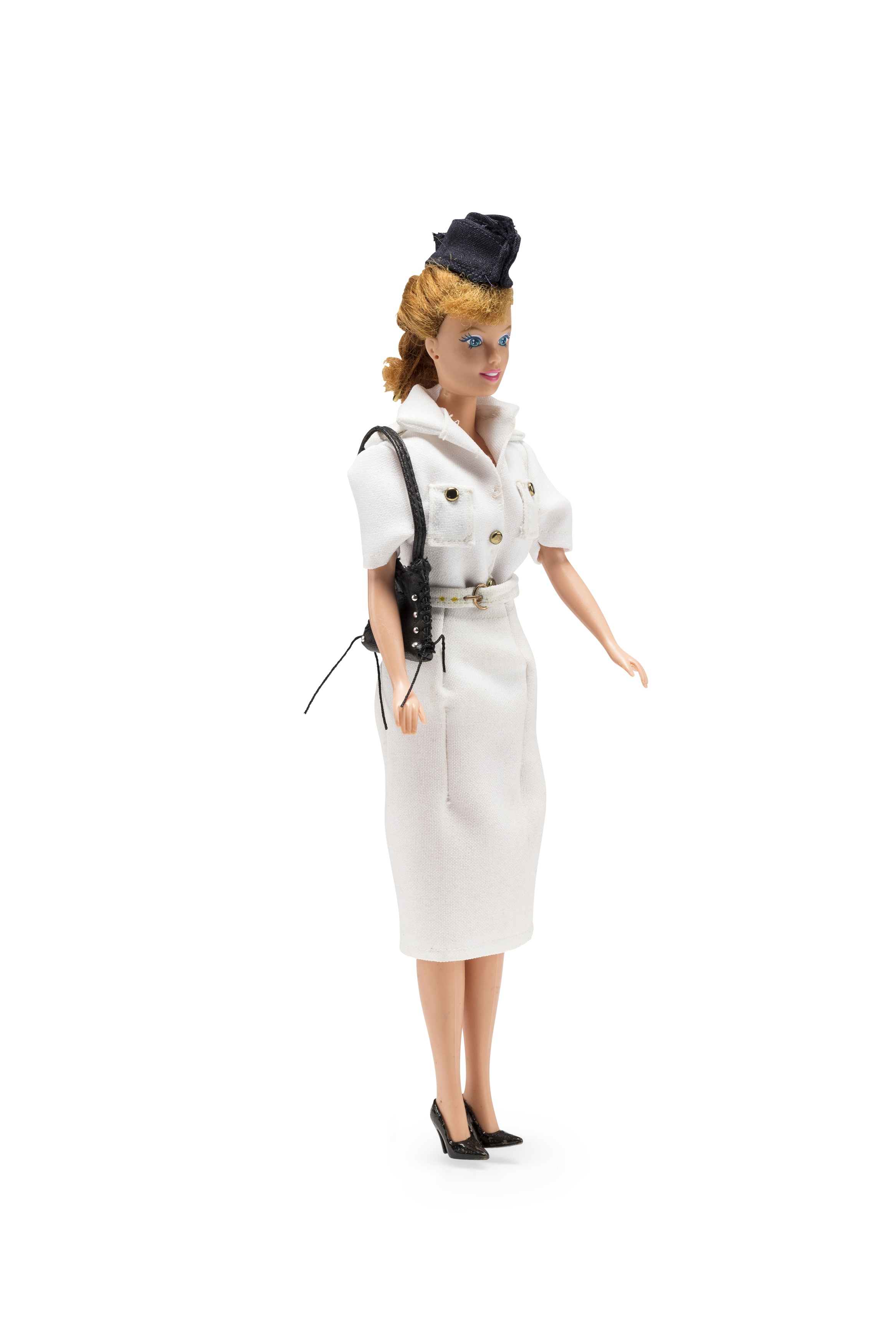 Doll wearing 'tropical' Qantas uniform worn by flight attendants from 1948-1959