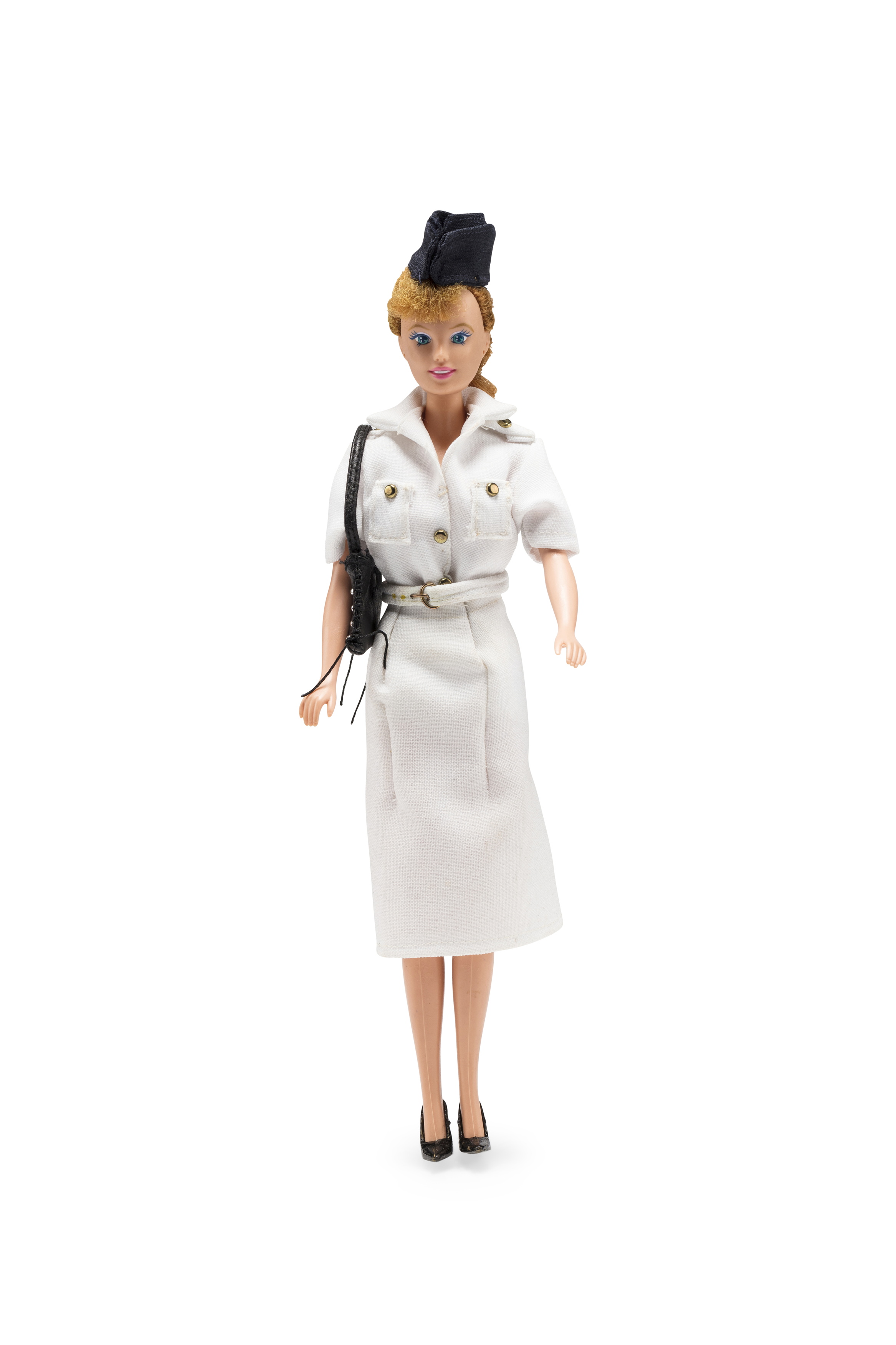 Doll wearing 'tropical' Qantas uniform worn by flight attendants from 1948-1959