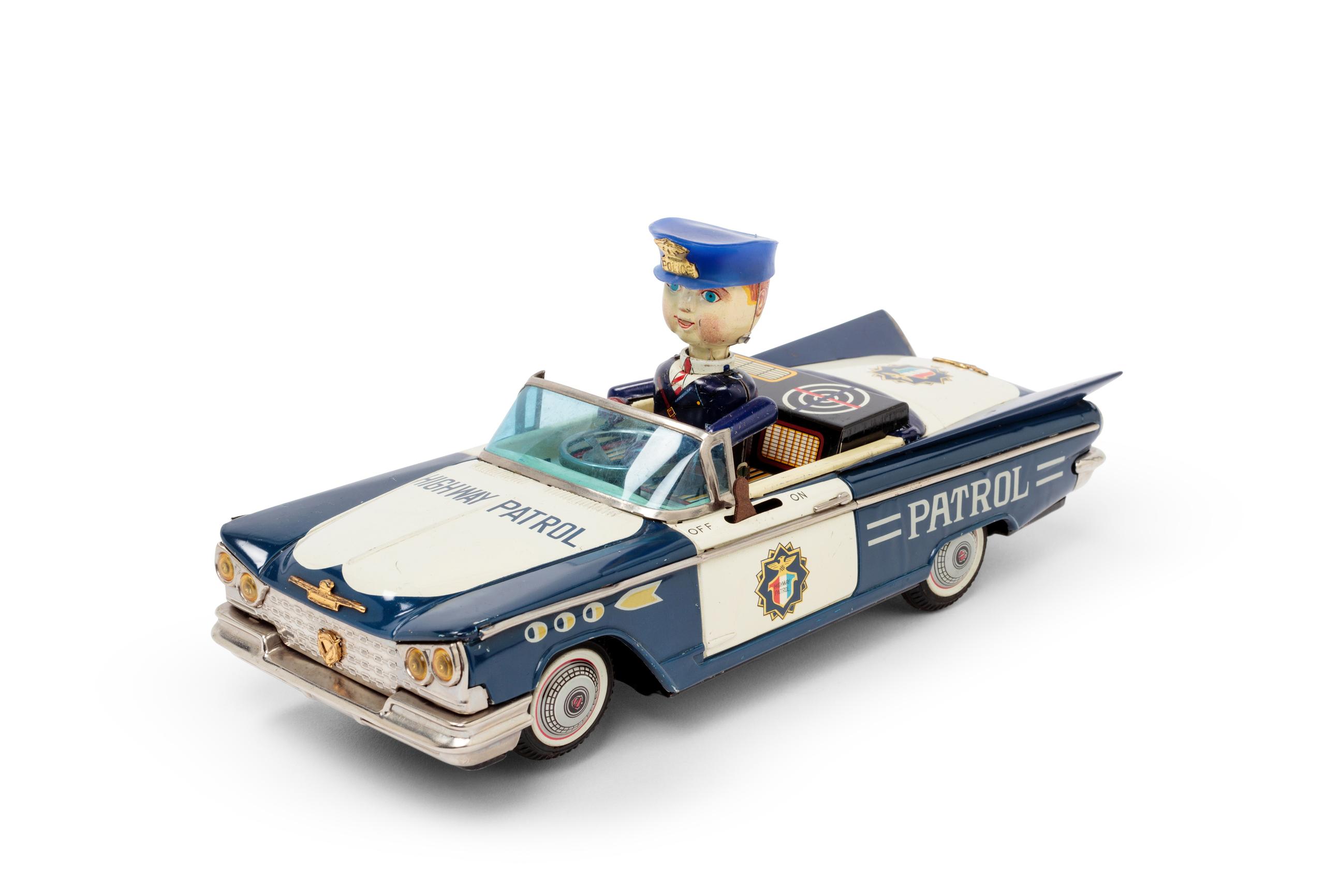 Powerhouse Collection - Buick Highway Patrol toy car and stand, 1960