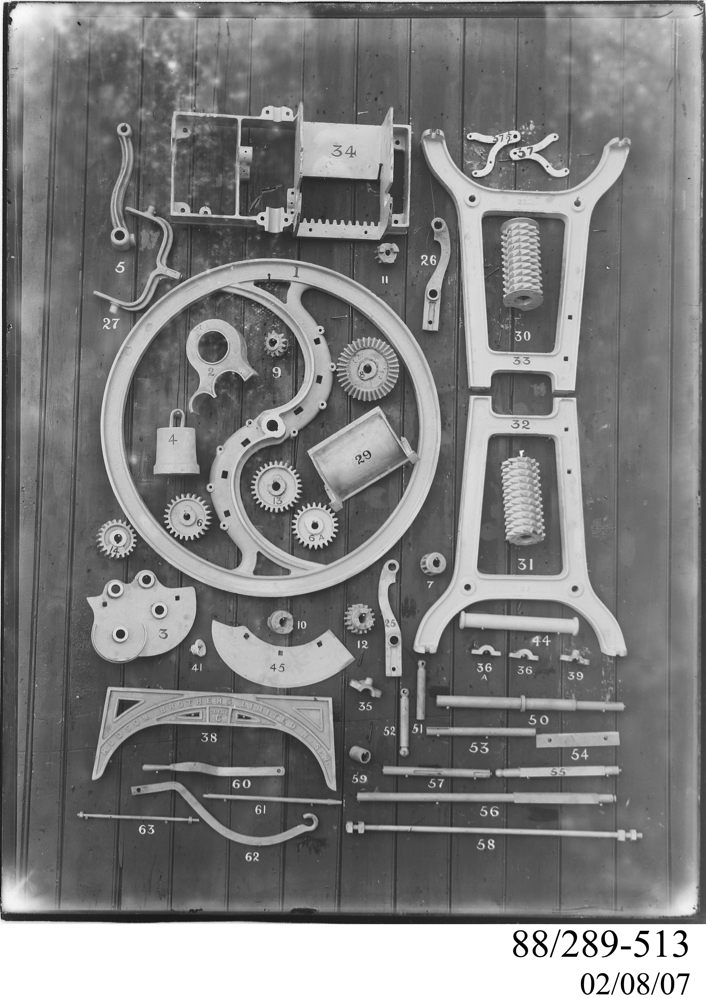 Glass plate negative of components of Hudson Brothers chaff cutter