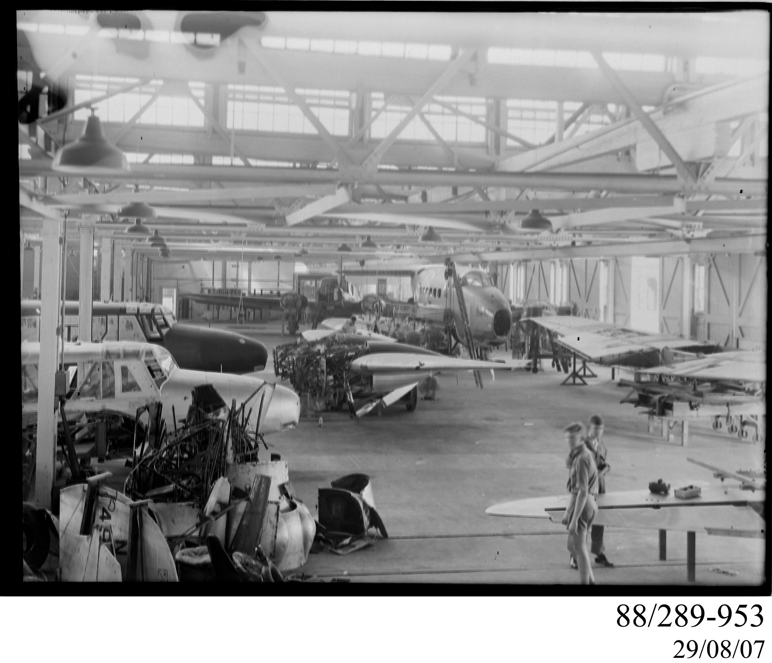 Glass plate negative of the general view of aircraft in workshops