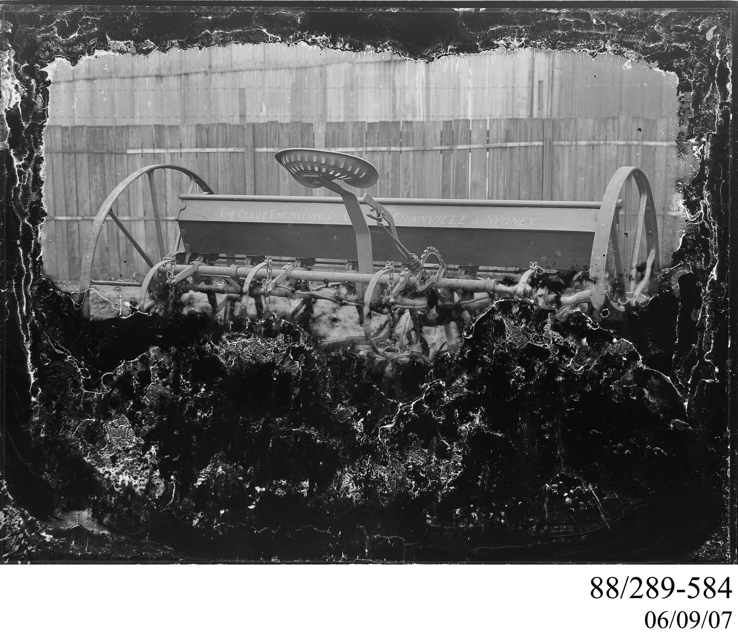 Glass plate negative of Clyde seed and fertilizer drill