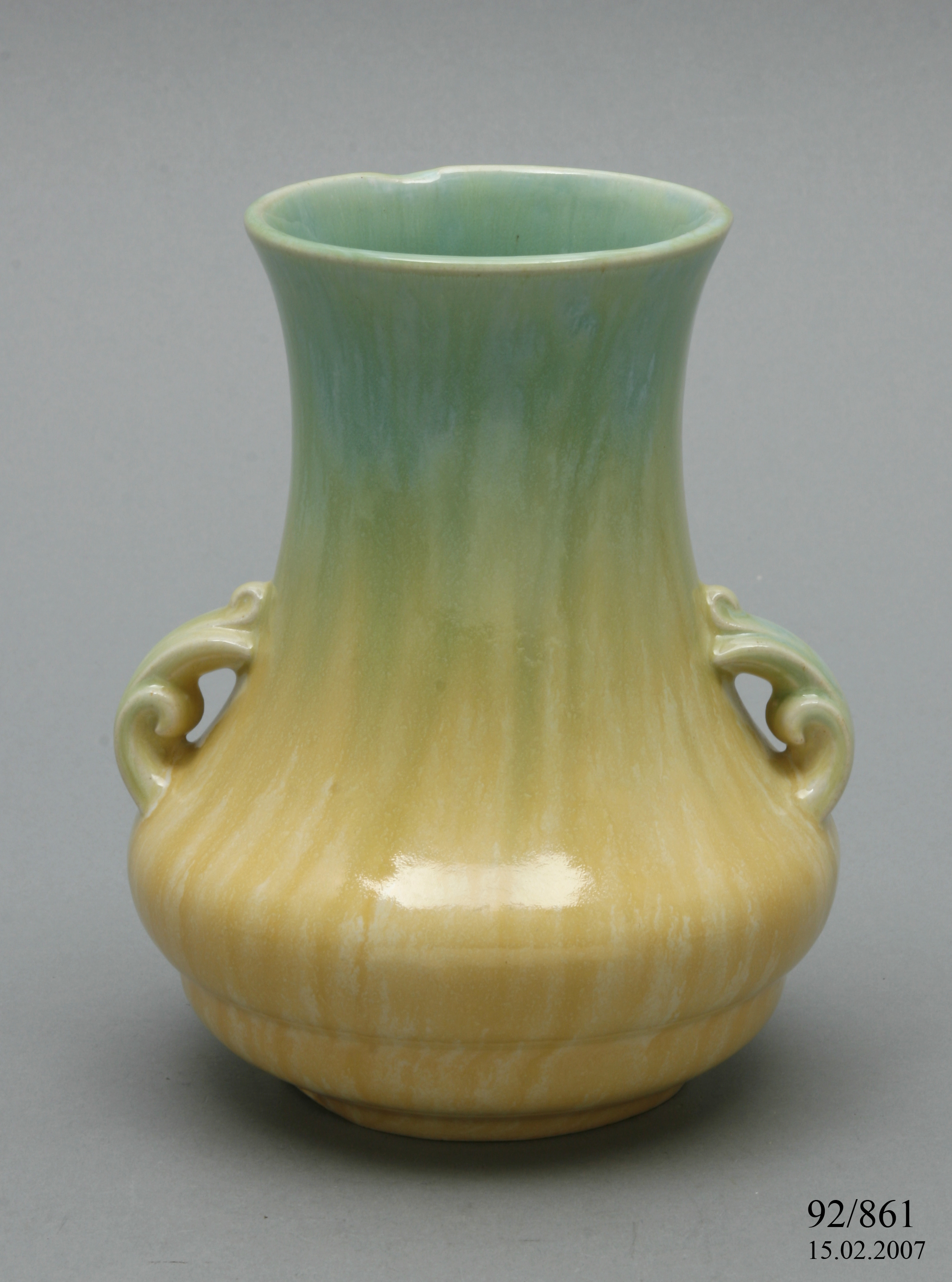 A Pates Potteries slip cast vase.
