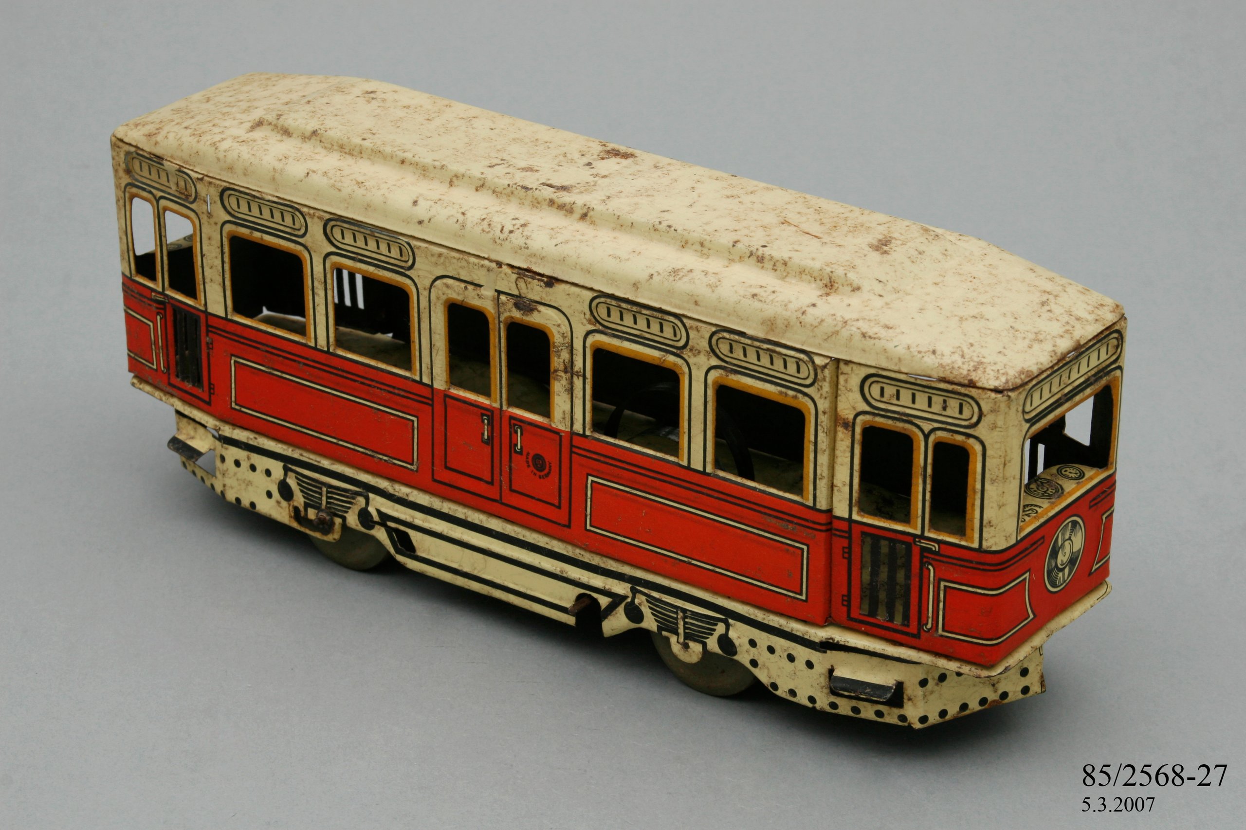 Red and cream tin plate toy tram