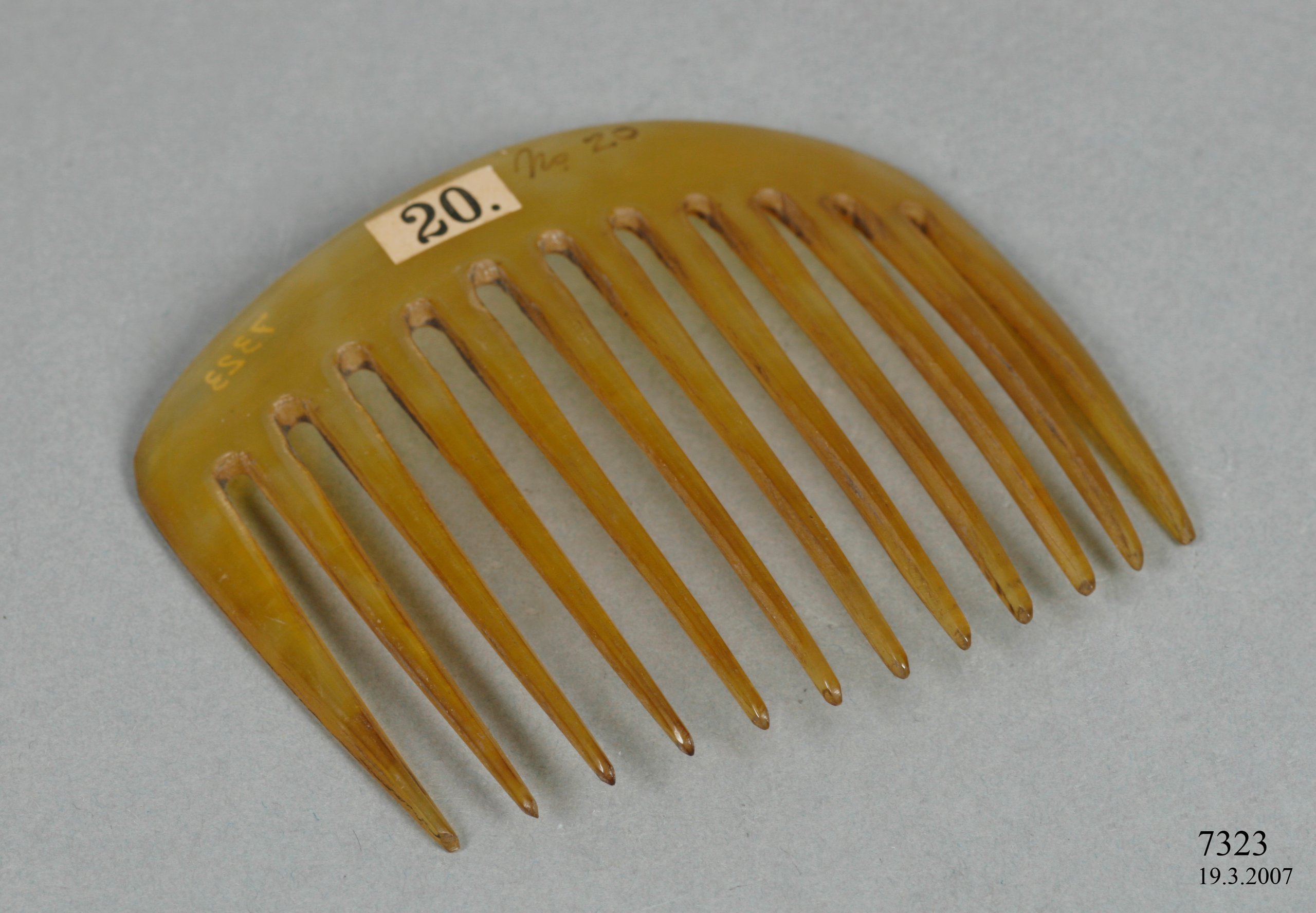 Ox horn hair comb showing stages of production