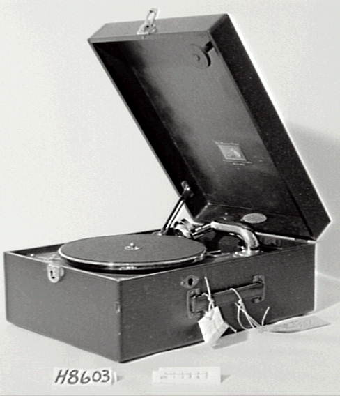 Portable gramophone in case with records and needles
