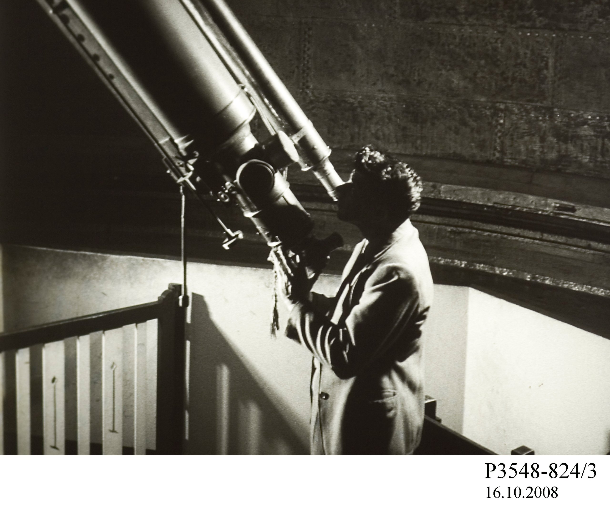 Film strip showing a man looking into a telescope