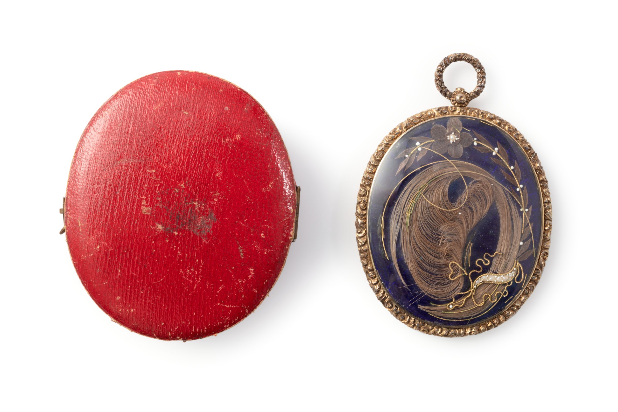 Mourning locket with hair of two sisters