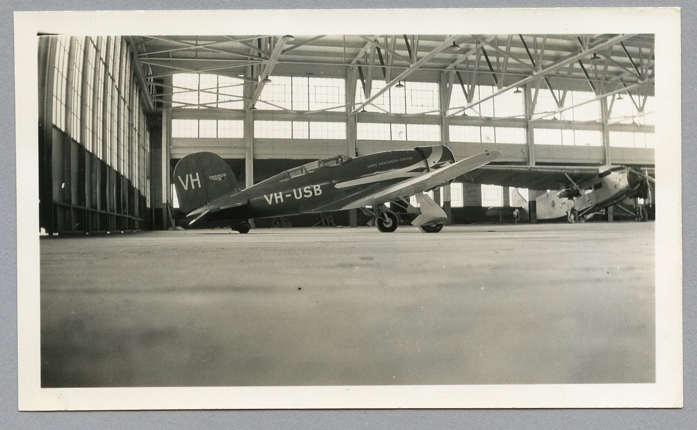 Photograph of the "Lady Southern Cross" aircraft in hangar at Oakland Airport, California, USA, 1934